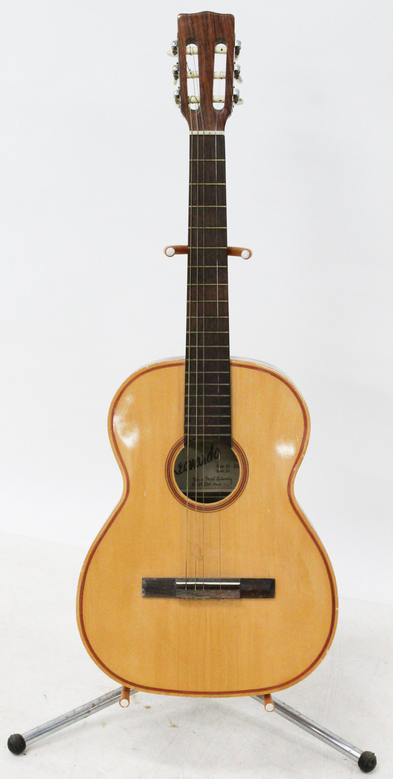 Leonardo Classical Guitar: Leonardo Classical Guitar, made in Brazil, bridge appears to be reset, comes with later chipboard case. 24" scale 39" overall