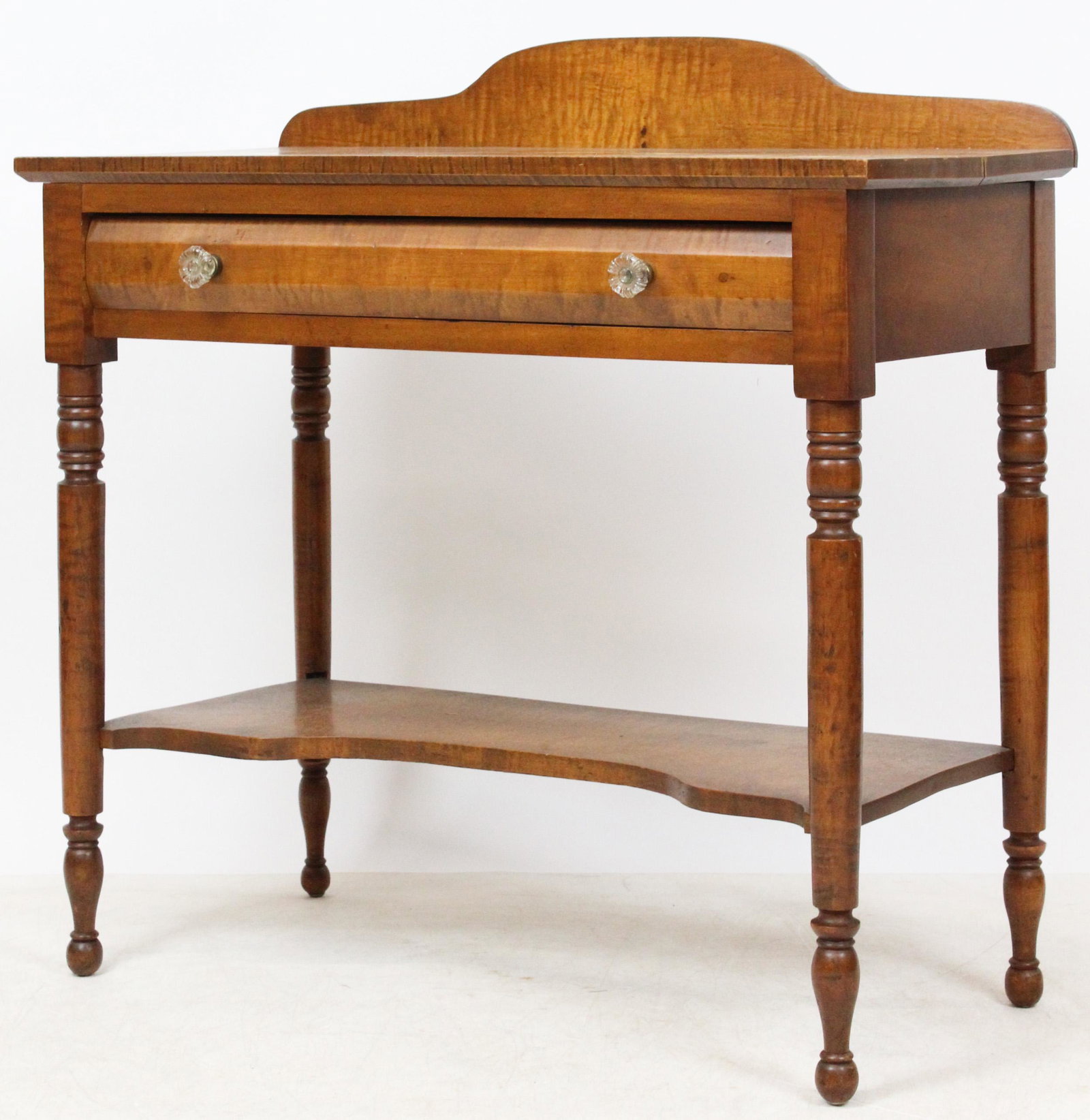 Sheraton Tiger Maple Wash Table: 19th c Sheraton tiger maple single drawer wash stand. Shaped lower shelf. Good tiger maple. Water stains on top. 32" h, 34"w, 17" deep.