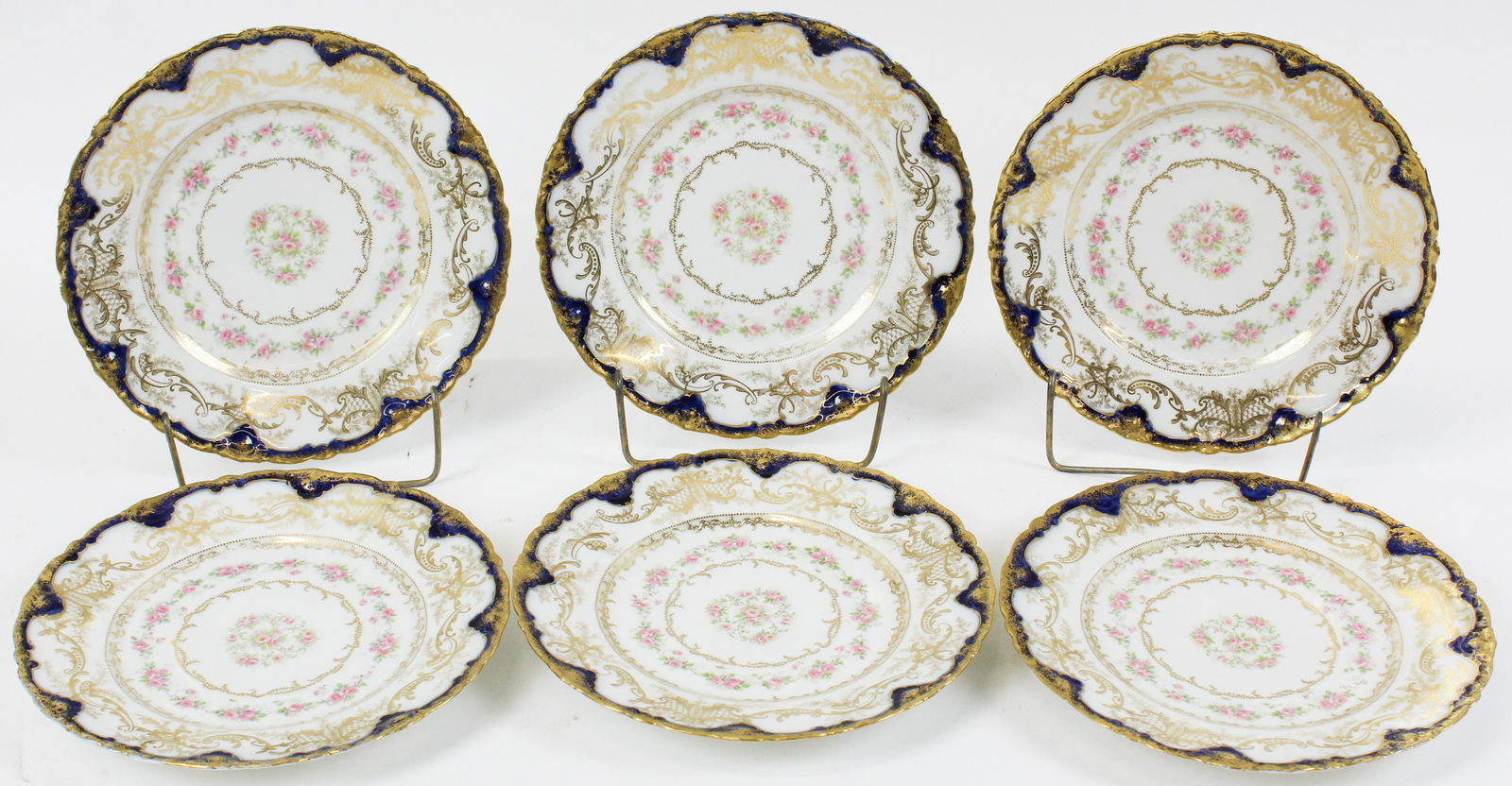 6 Fine Haviland Limoges Luncheon Plates: Set of 6 Theodore Haviland Limoges porcelain luncheon plates with pink floral gold encrusted decoration and cobalt accented border dia. 9" -one has a rim nick