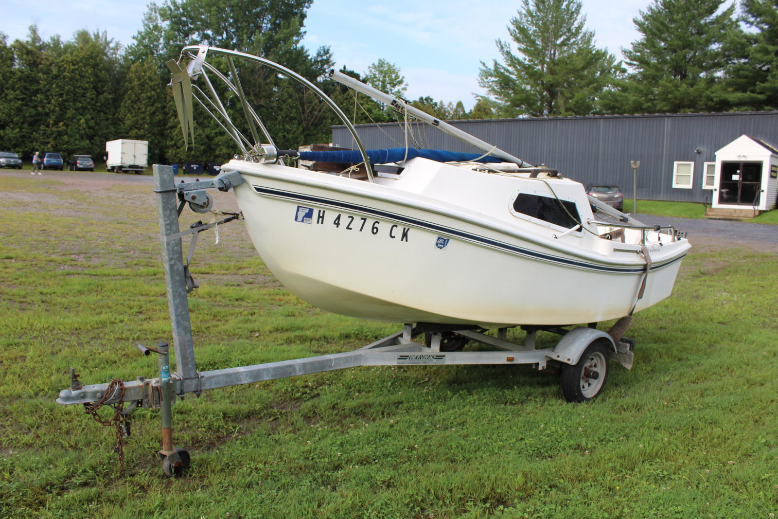 West Wight Potter Sailboat: West Wight Potter sailboat on Garges trailer, approx 15' long, with sail, cover, cushions for berth, Last registered 2017 said to sail well. Located at our gallery in Williston, will need to be towed 