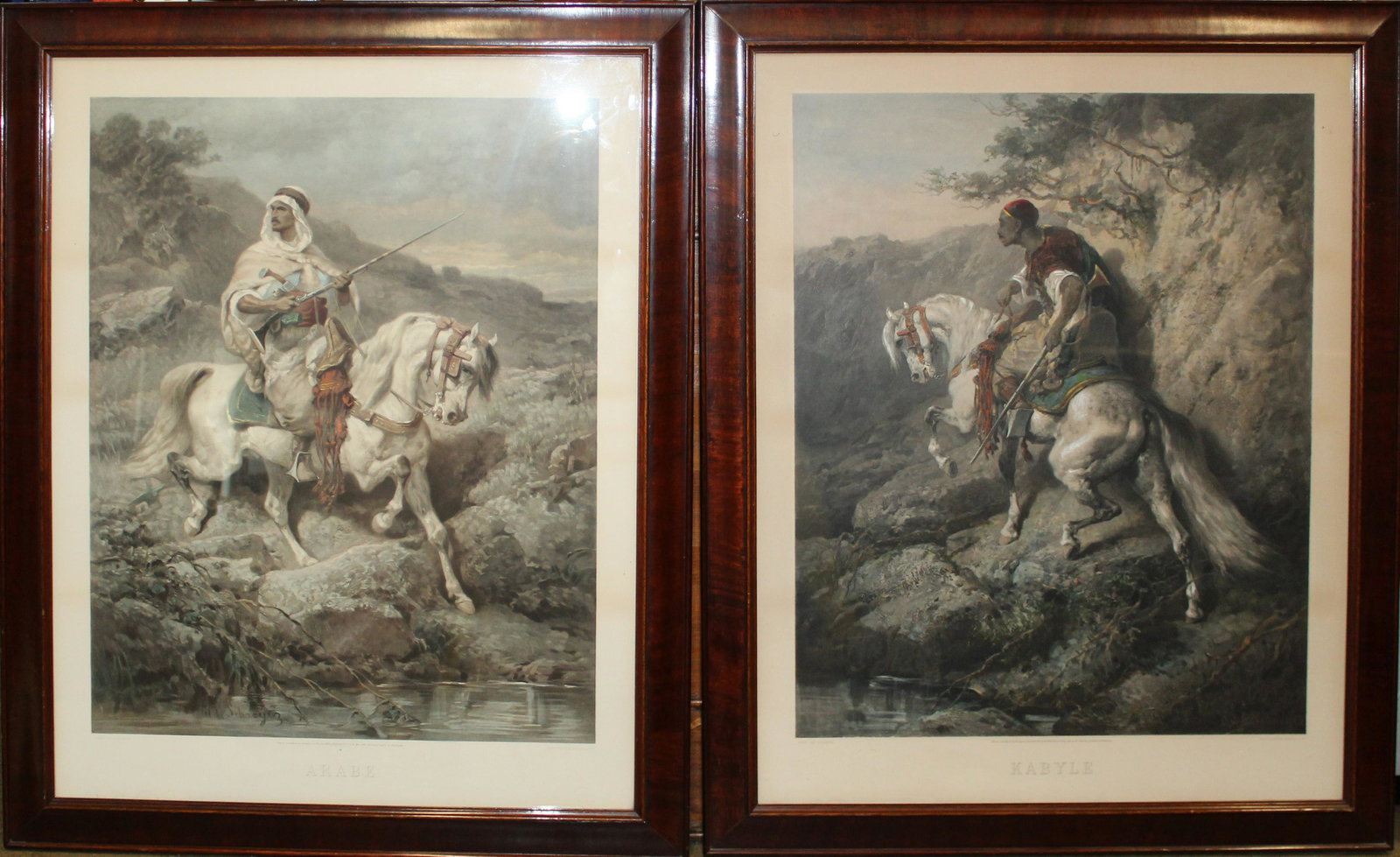 Adolph Schreyer (DE 1828-1899) Two Photogravures: Adolph Schreyer (German 1828-1899) Two ca 1881 hand colored photogravures of sensationalized Orientalist subjects "Arabe" and "Kabyle" published by Goupil - Plates 25 x 19"