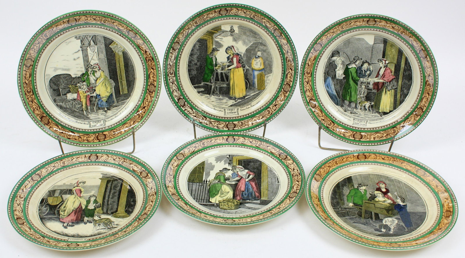 6 Adams Cries Of London Transferware Plates: Set of 6 Adams "Cries of London" English porcelain dinner plates with polychrome decorated scenic transfer panels surrounded by colorful green and brown classical frieze dia. 10"