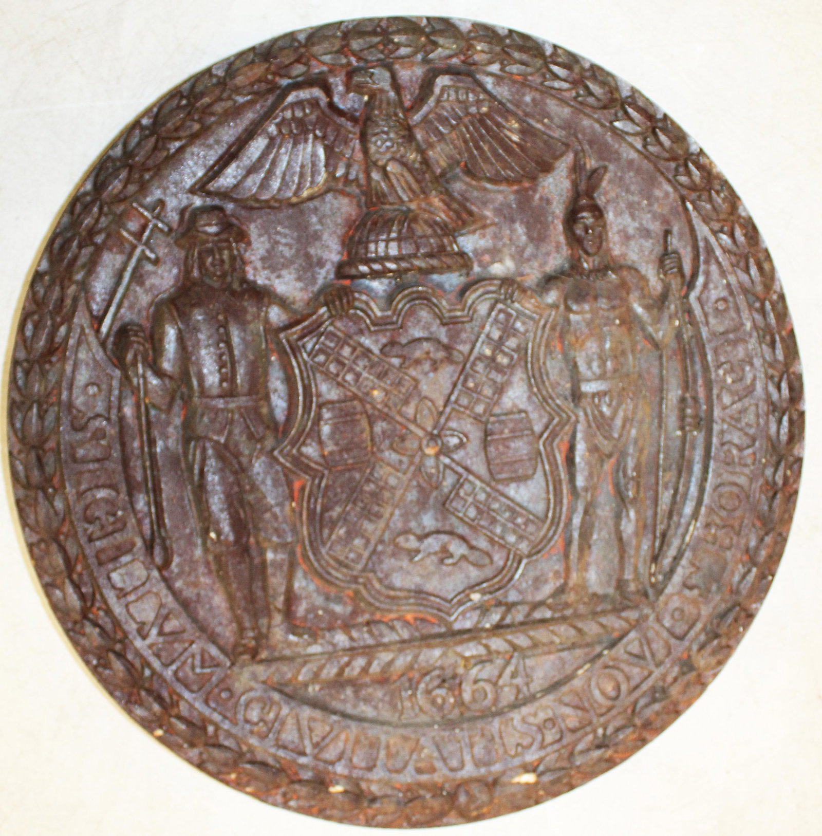 Cast Iron New York City Seal: 18" cast iron New York City seal - Featuring Settler, First Nations Warrior, Windmill and Beaver devices. With four threaded attachment points reverse. (Please note this object is approx 60 pounds and