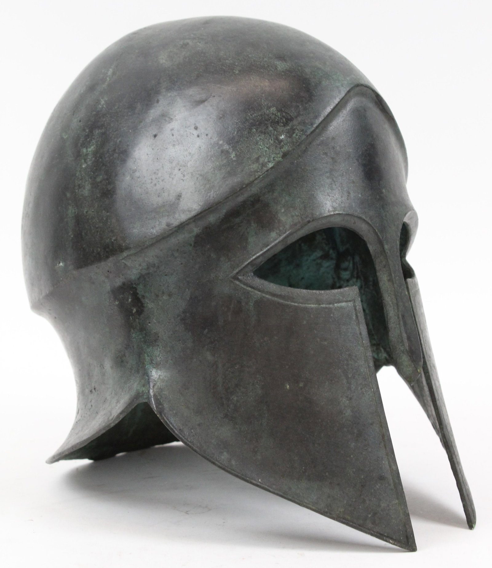 Bronze Corinthian Style helmet: Bronze Corinthian style helmet 20th c casting of ancient piece.