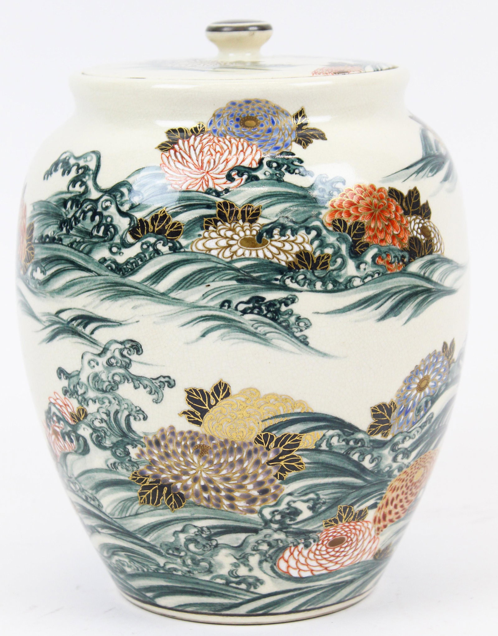 Japanese Meiji Water Jar signed Ito Tozan: Japanese Meiji/ early Taisho period earthenware water jar decorated with kuku in waves, spume curling over the blossoms, Ito Tozan incised mark on the base, ht 8 1/2"