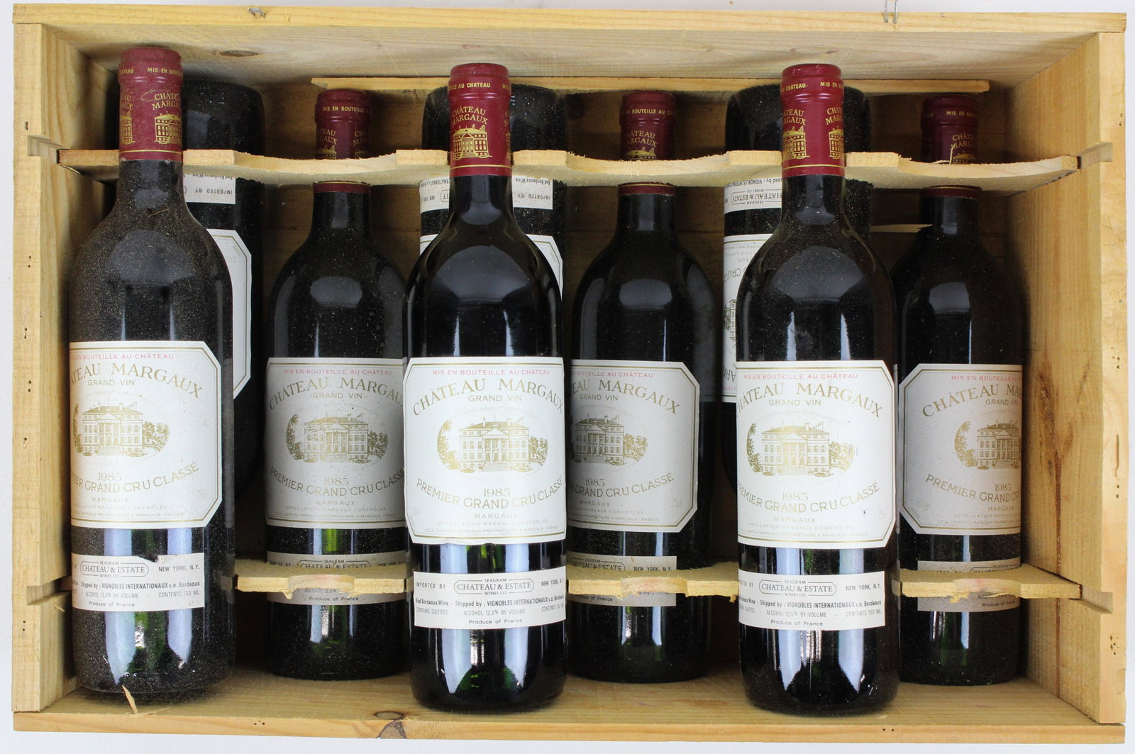 9 - 1985 Chateau Margaux Wine: 9 bottles still in case of 1985 Chateau Margaux Premier Grand Cru Classe. Good overall condition. Estate of Iris Love.- Proceeds from this lot will benefit Brattleboro Area Hospice. Please note and be