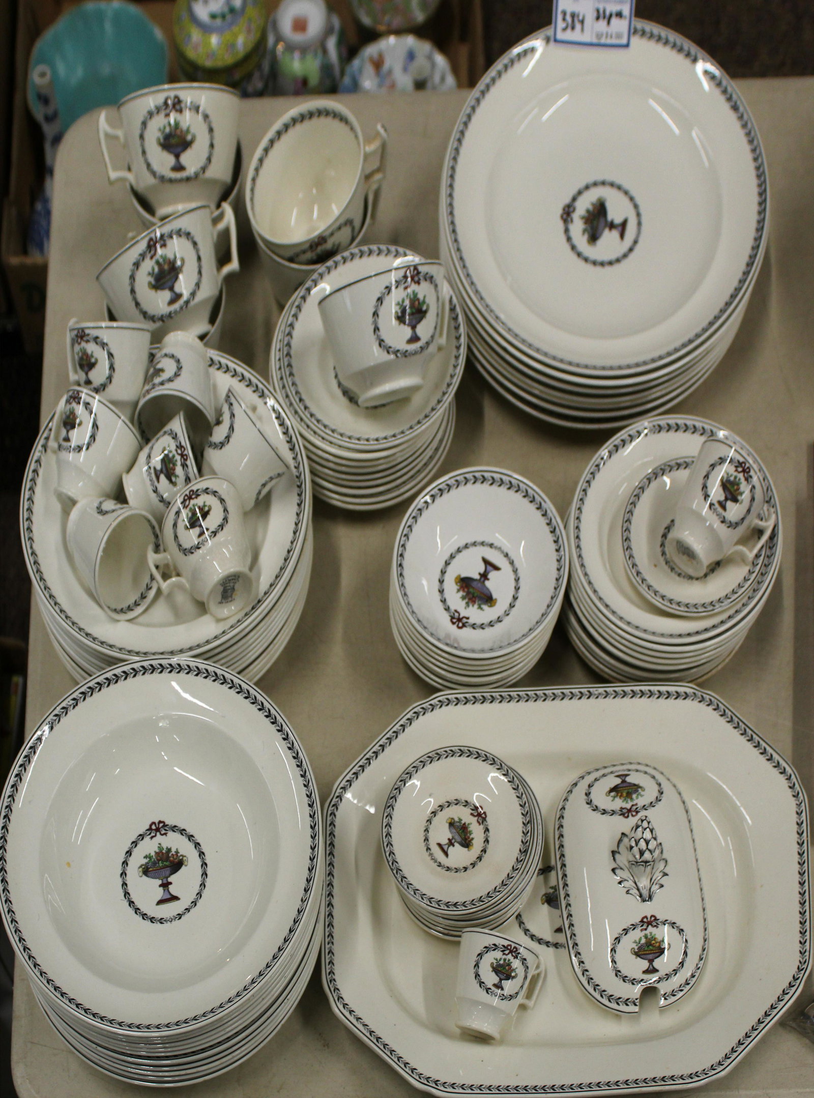 83 pcs. Spode Chaplet Porcelain Dinnerware: 83 pcs. Copeland Spode "Chaplet" pattern porcelain dinnerware with neoclassical laurel and fruit centerpiece cartouche, including luncheon plates, soup bowls, demitasse cups and saucers, side bowls, o