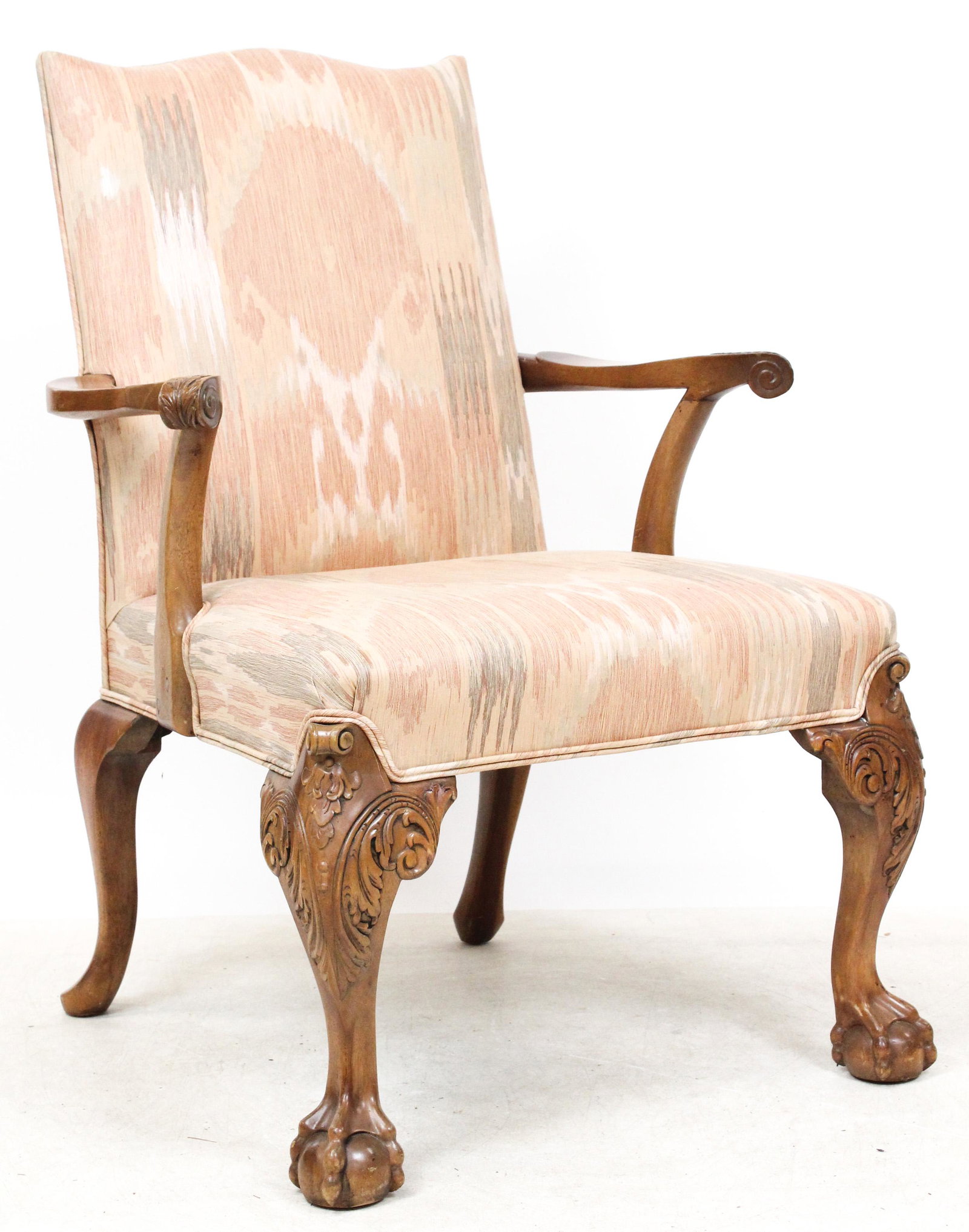 19th c Carved Chippendale style armchair: late 19th early 20th c carved mahogany Chippendale style armchair with acanthus carved arms and a well defined ball and claw foot. In later upholstery