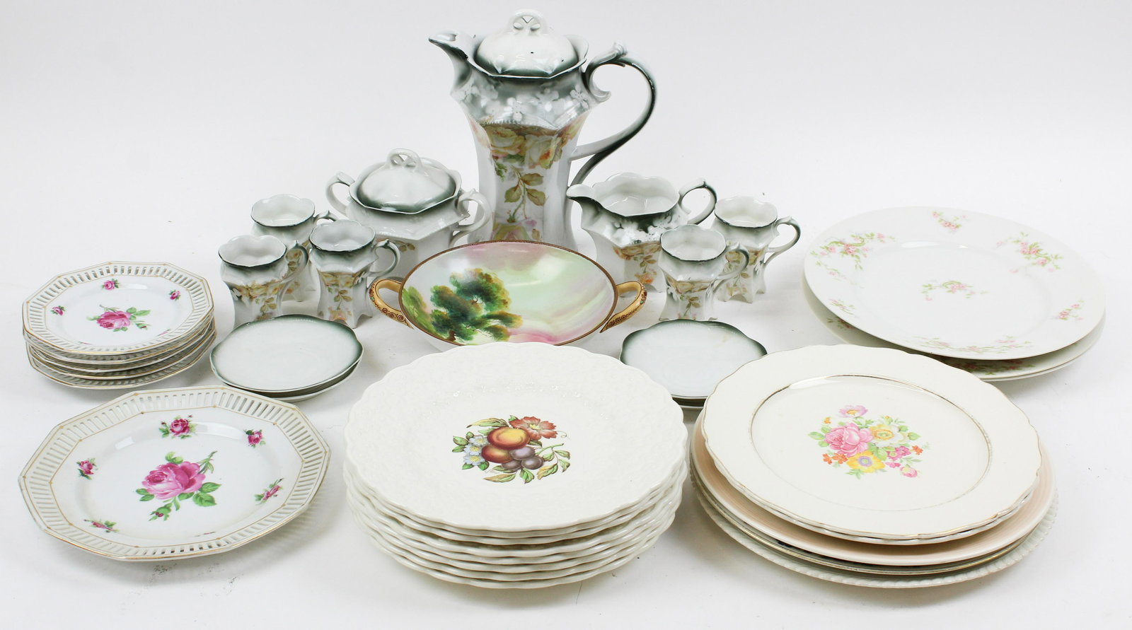 Assorted Porcelain Tableware incl. Spode: Group of assorted porcelain tableware including 8 embossed Copeland Spode fruit decorated dinner plates, 6 pc. Schumann dessert set, Nippon scenic footed bowl, and a group of various patterned dinner 