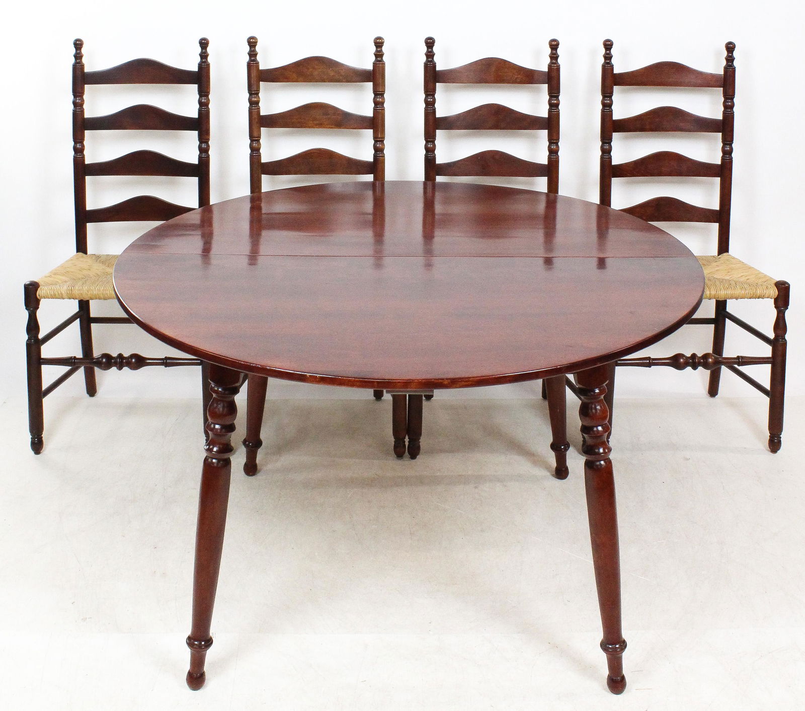 Ethan Allen by Baumritter Cherry Dining set: Five Piece Ethan Allen by Baumritter cherry dining room set with extension dining table and four ladderback dining chairs. 48" diameter 29" tall chairs are 42" tall.