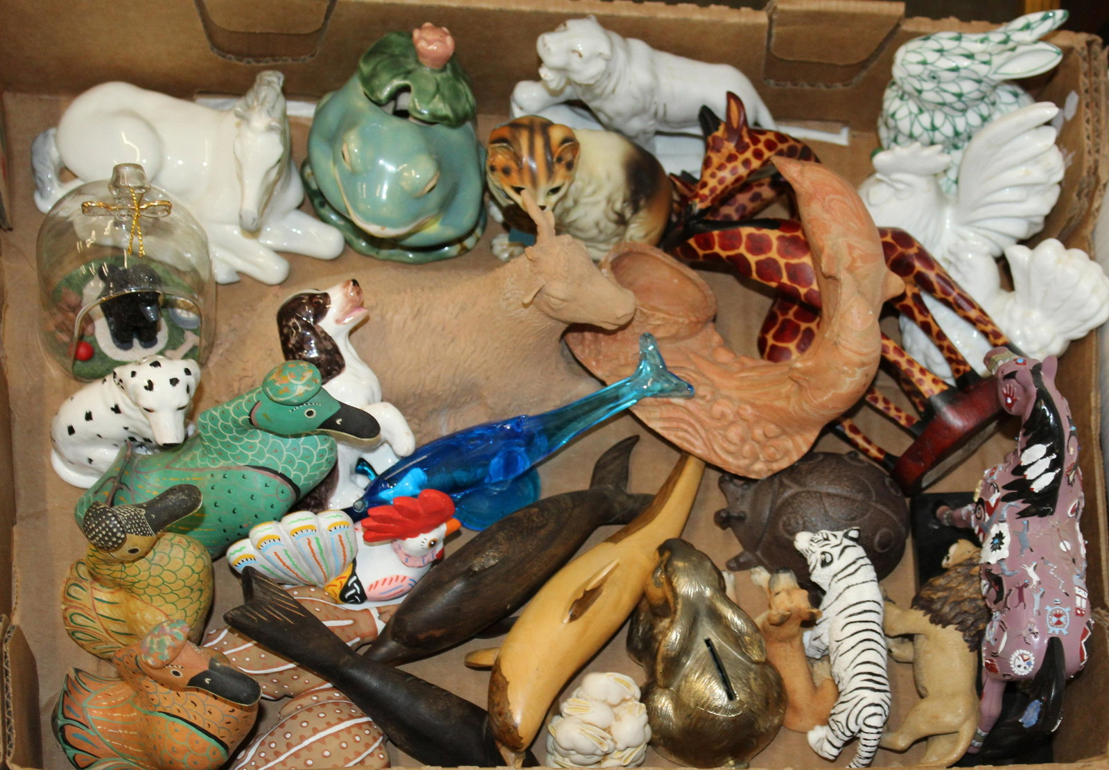 Collection of Assorted Animal Figurines: Collection of assorted animal figurines including Fitz and Floyd dog, blue glass dolphin, fishnet rabbit, etc. -from the estate of Iris Cornelia Love