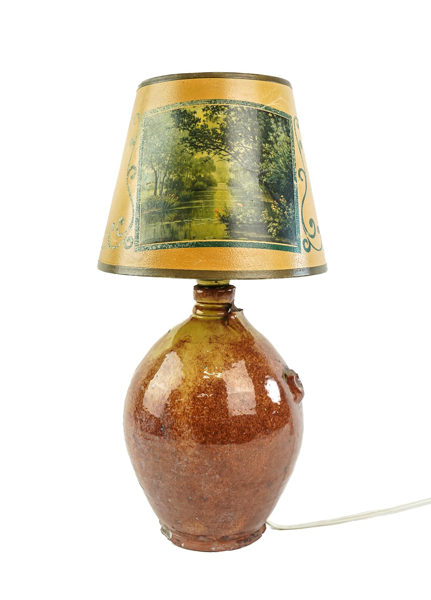 Vermont Redware Ovoid Jug: Hinesburg or East Middlebury Vermont redware ovoid jug. Red speckled glaze with mustard. Missing handle, glaze ware to base edge. Top with lamp insert. Jug 9" h.