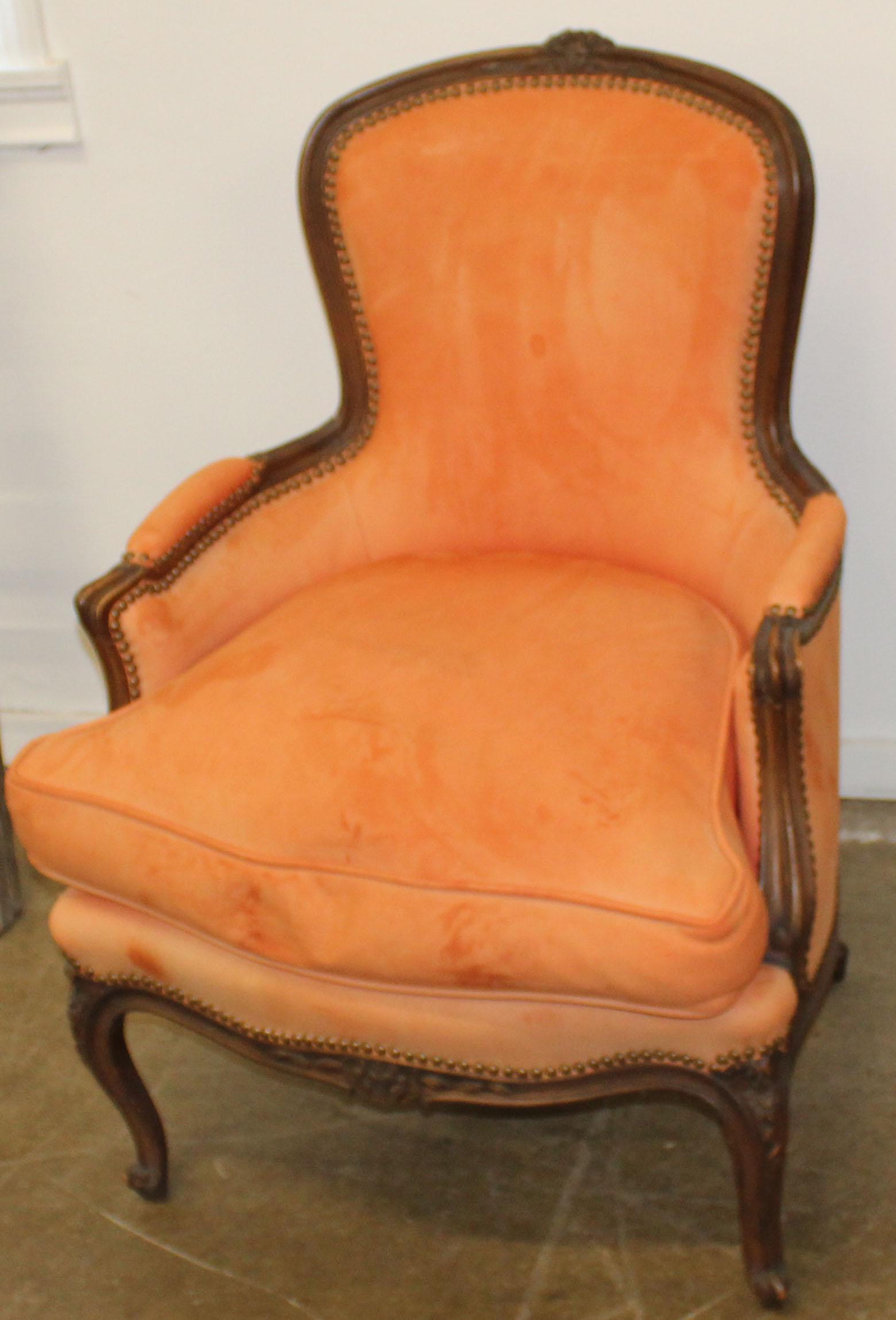 French Louis XV Style Bergere Armchair: 20th c. French Louis XV style carved bergere armchair in tangerine suede brass tacked upholstery -some fading and staining, good useable condition 37" x 26" x 23"