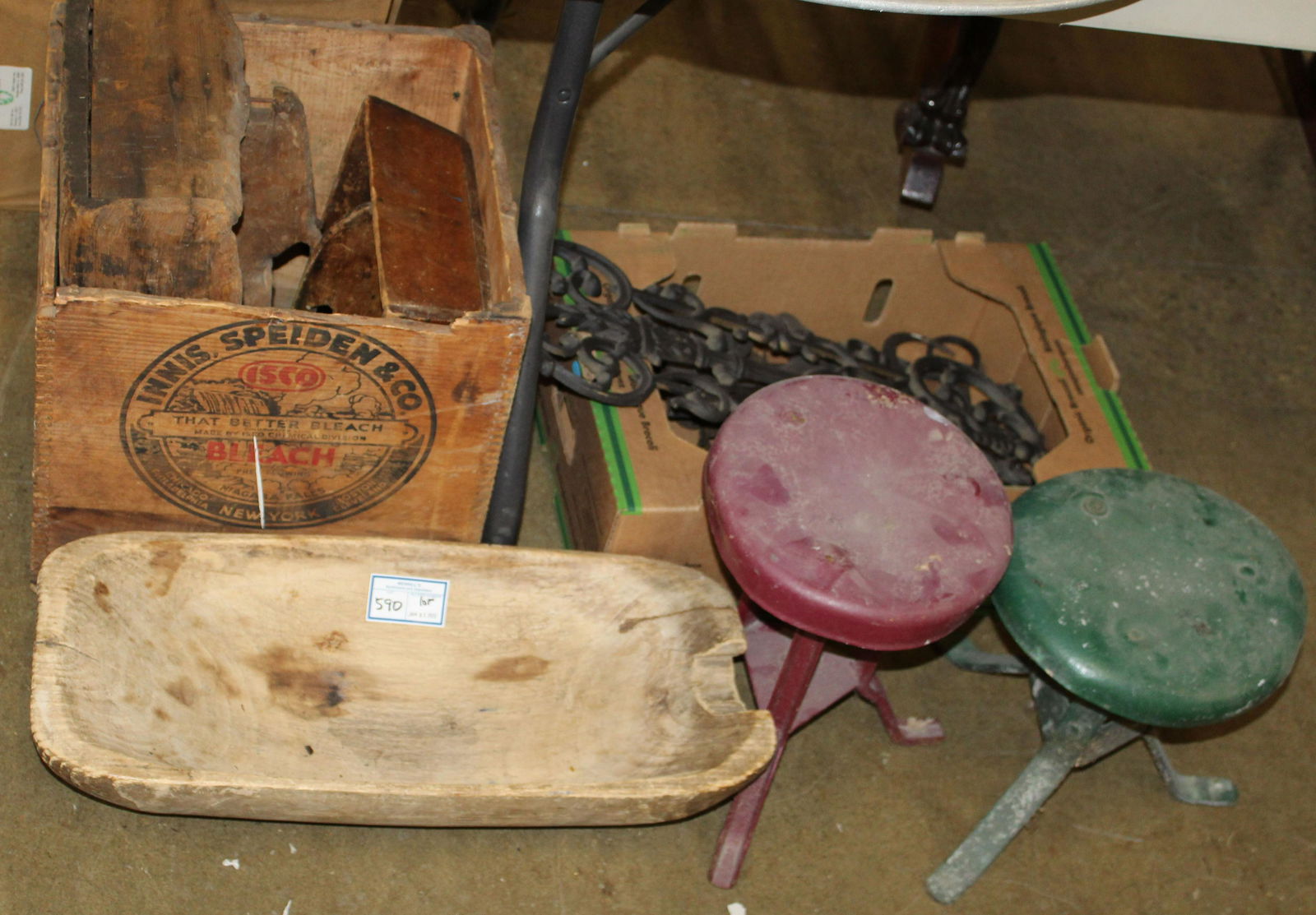 Group of Country Primitives, Iron, Milking Stools: Group of country primitives including wooden trencher bowl (missing chunk of rim), wooden advertising crate, 2 wooden utensil or tool carriers, iron trivets and stillyard, cast iron fence panel, etc.