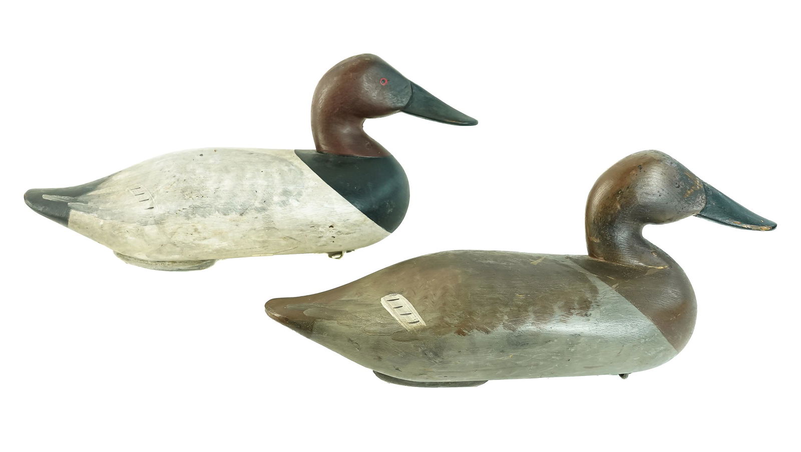 Pair of Canvasback Decoys: A pair of Canvasback drake decoys. Attributed to Charles Bryan Wilson Point or Middle River, Maryland (Harve de Grace). Good original paint, paint eyes, rear keel lead weight, light working wear. 16"