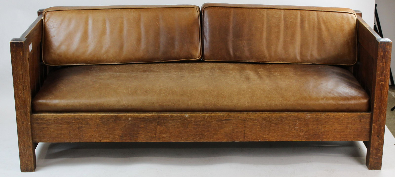 Gustav Stickley 226 Mission Oak Settee: Gustav Stickley Arts and Crafts era mission oak #226 settee with horizontal slat back, having 5 vertical slats on sides, through tenon and pegged construction, in original finish with later leather up