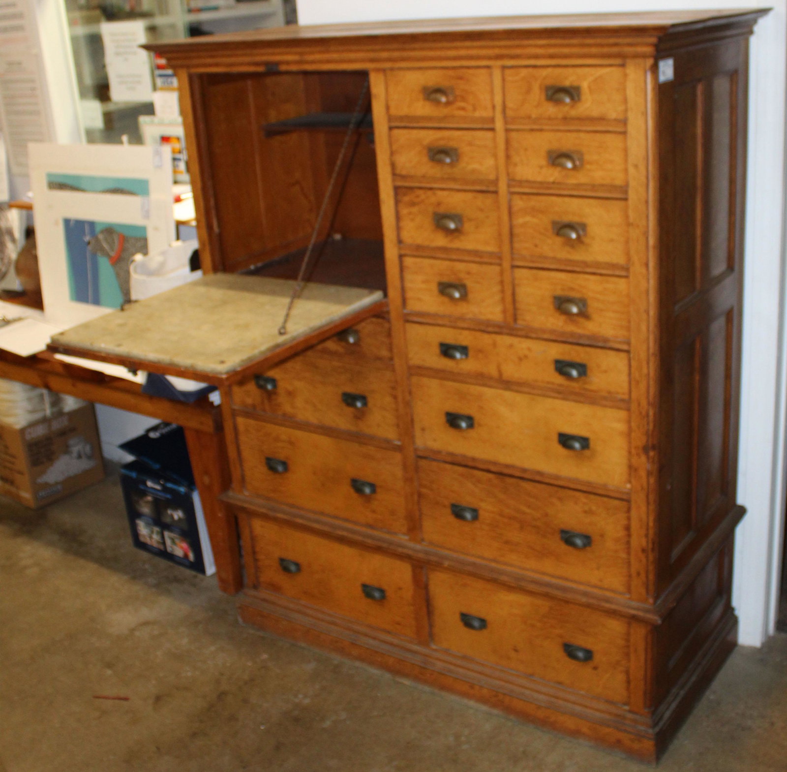 Quartersawn Oak 16 Drawer Apothecary Cabinet: ca. 1900 quartersawn oak vertical apothecary cabinet having 16 drawers of varying size and unusual drop front panel compartment with marble work surface for mixing liquids and compounds, brass tone cu