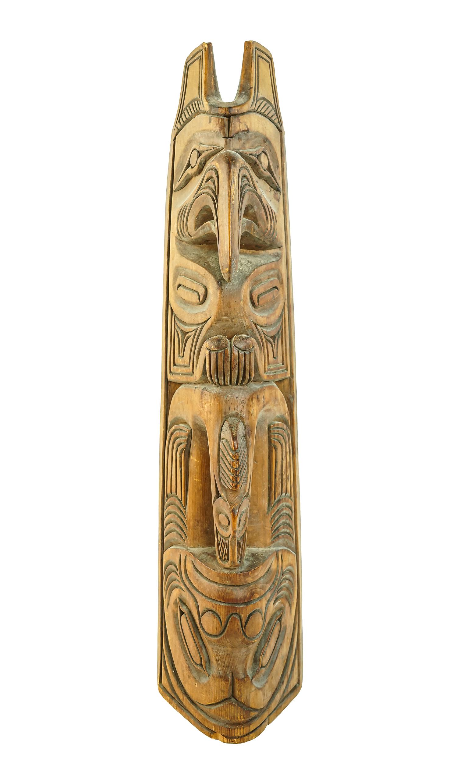 Northwest Coast Clan Totem: Northwest Coast carved wooden clan totem, natural surface with oxidized patina, ht 17"