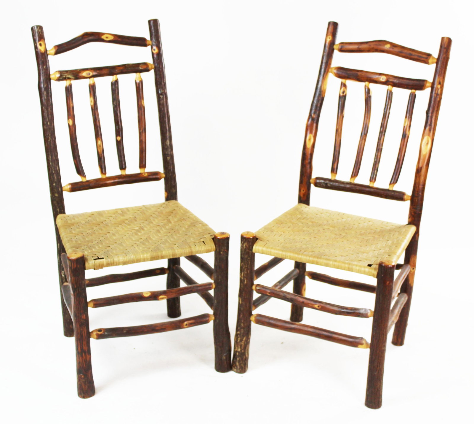 Set of 4 Old Hickory style Rustic Dining Chairs: Set of 4 Old Hickory style rustic Adirondack camp dining chairs with spindle backs amd woven splint seats and arched top rails, some wear to seats, overall very good condition 39" x 19" x 19"