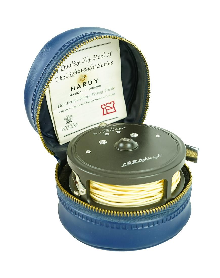 Hardy Lightweight Fly Reel: A near mint Hardy England L.R.H Lightweight fly reel. In original case, with 7 weight line, and original papers. 3 1/8" diameter.