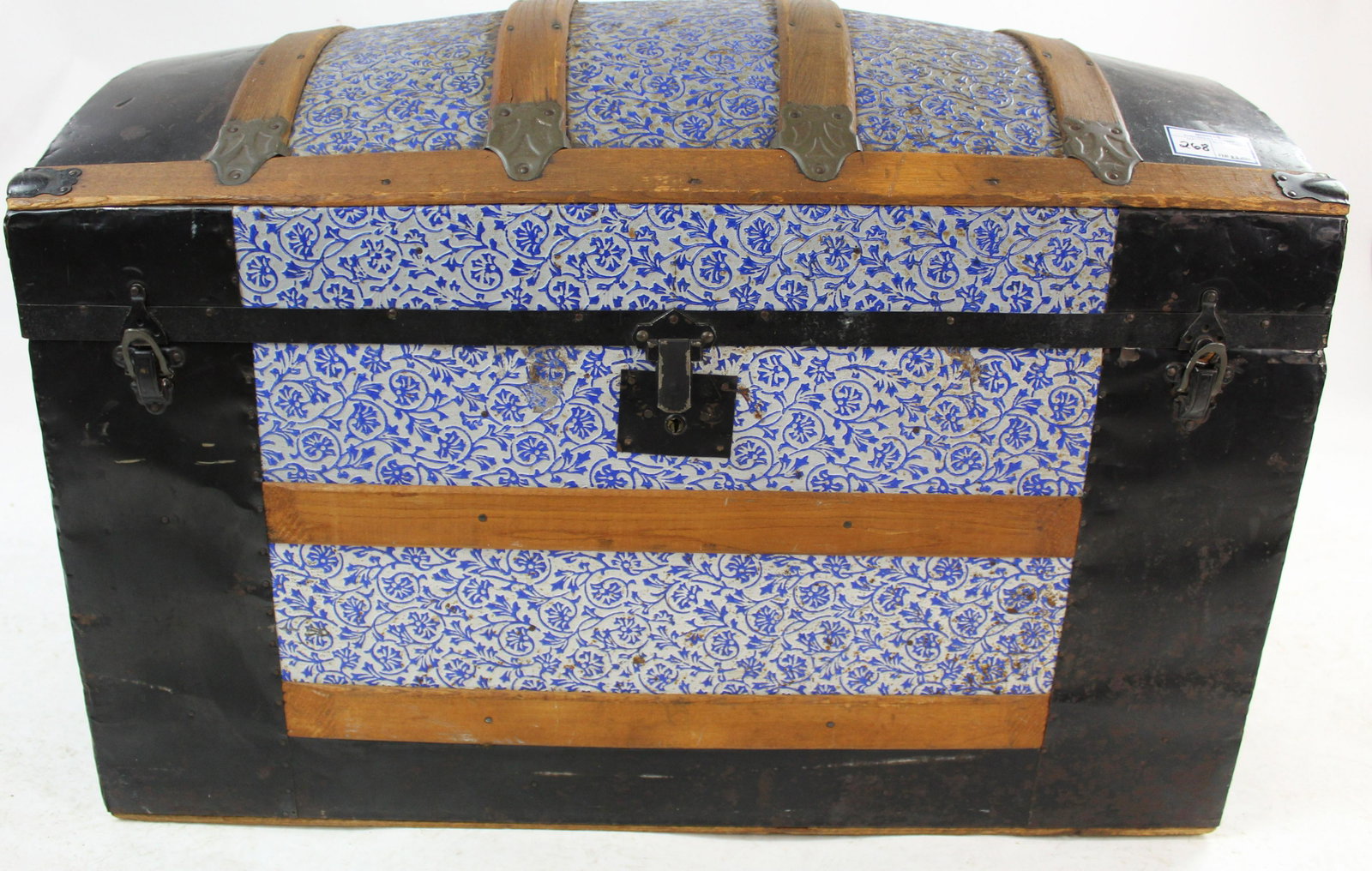 Victorian Embossed Tin Covered Dome Top Trunk: Victorian embossed tin covered dome top steamer trunk with oak slats in fine original condition, retaining unusual original blue highlights to floral design, with interior till 24" x 36" x 20" -one le