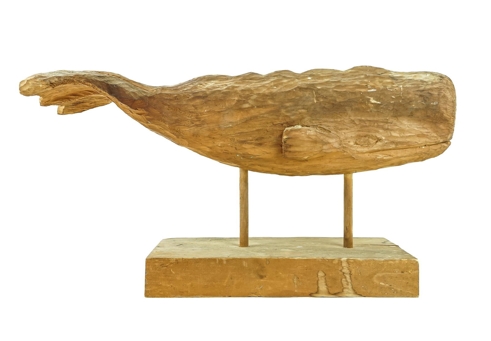 Carved Sperm Whale: Folk art 20th c carving of a Sperm Whale, full body with double pegs supporting above plaque. No finish and dry crack to body. Carved by Ron Gallant Stowe, VT. In the manor of Clark Vorrhees. 22" long