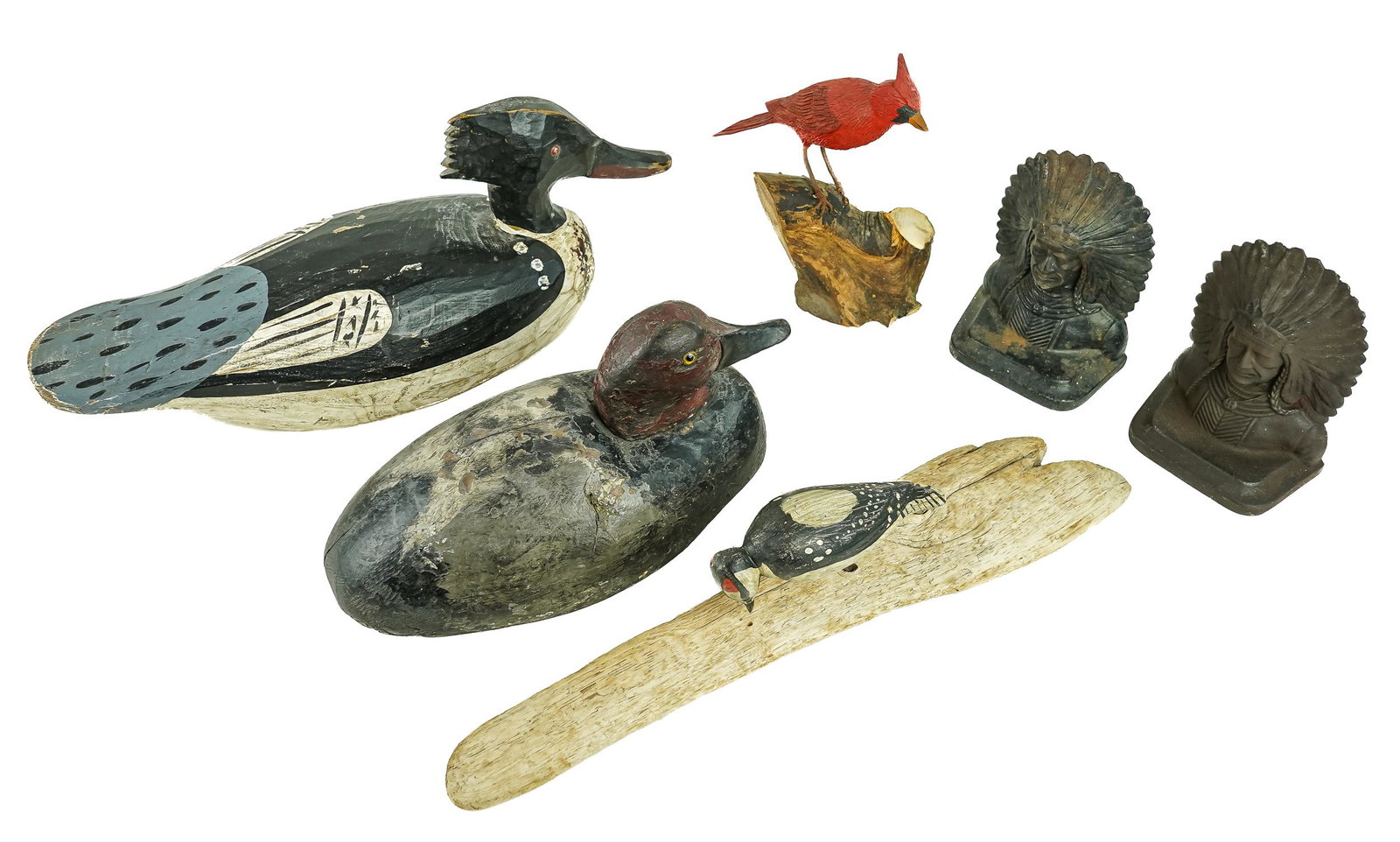 Decoys & Carvings: 4 Decoys and carvings including a Ca. 1900 Lake Michigan Redhead drake decoy, Merganser decoy, a carving of a Cardinal, carving of a Woodpecker on driftwood, and a pair of Chief bookends.