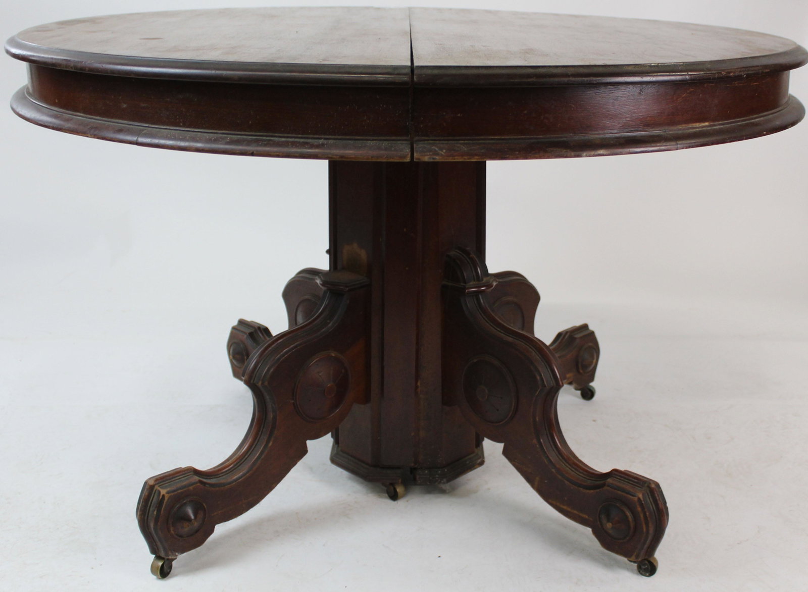 Victorian Round Black Walnut Dining Table: Victorian Renaissance Revival style round black walnut center pedestal extension dining table -no leaves present