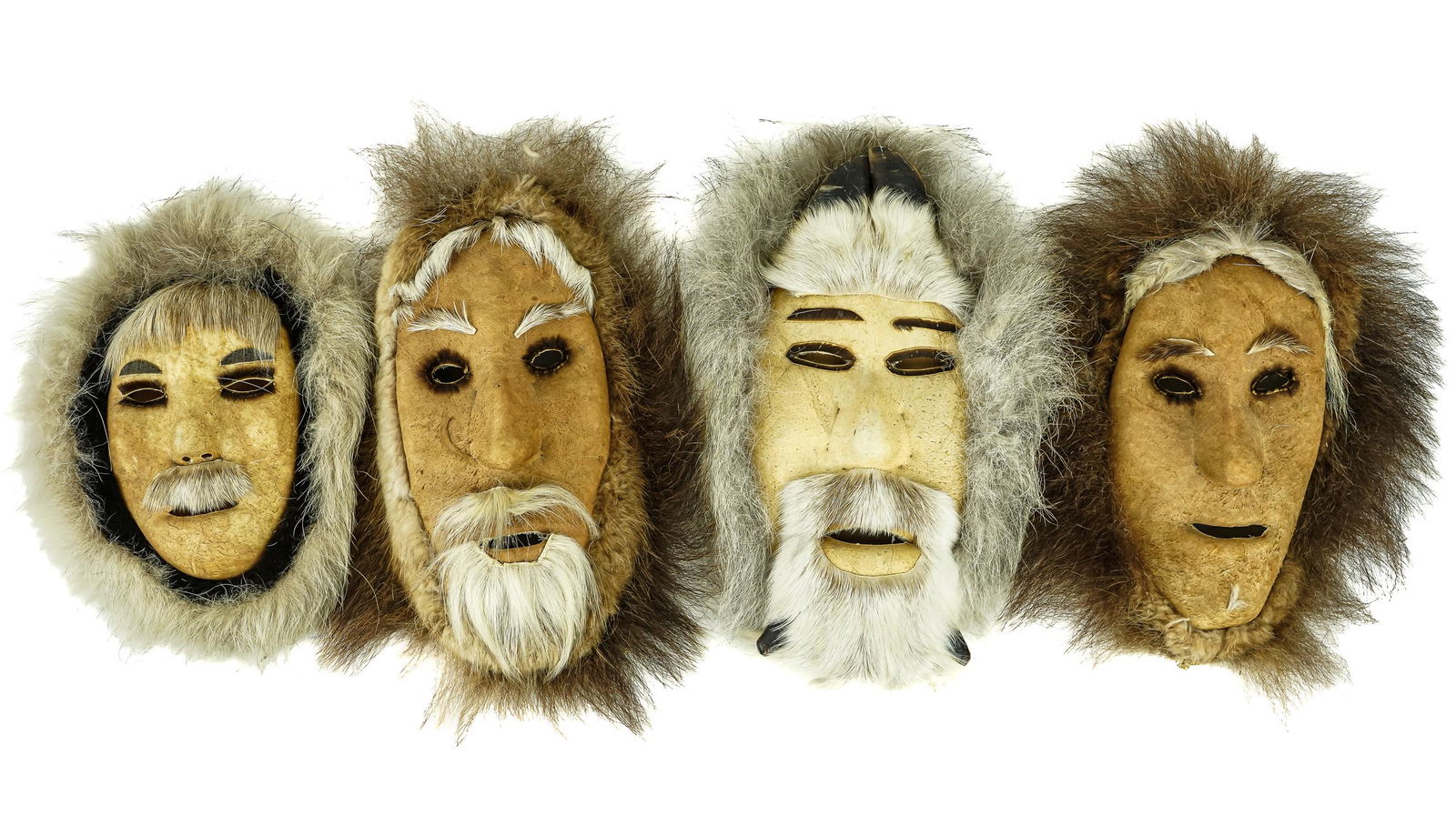 Four Eskimo/ Inuit Seal Skin Masks: Eskimo/ Inupiaq and Nunamiut caribou, seal skin masks (4 pcs), including signed Inupiak artist, hunter, and legend Elijah Kakinya (1895-1986) of Anaktuvuk Pass, Alaska, hts 10" to 13"