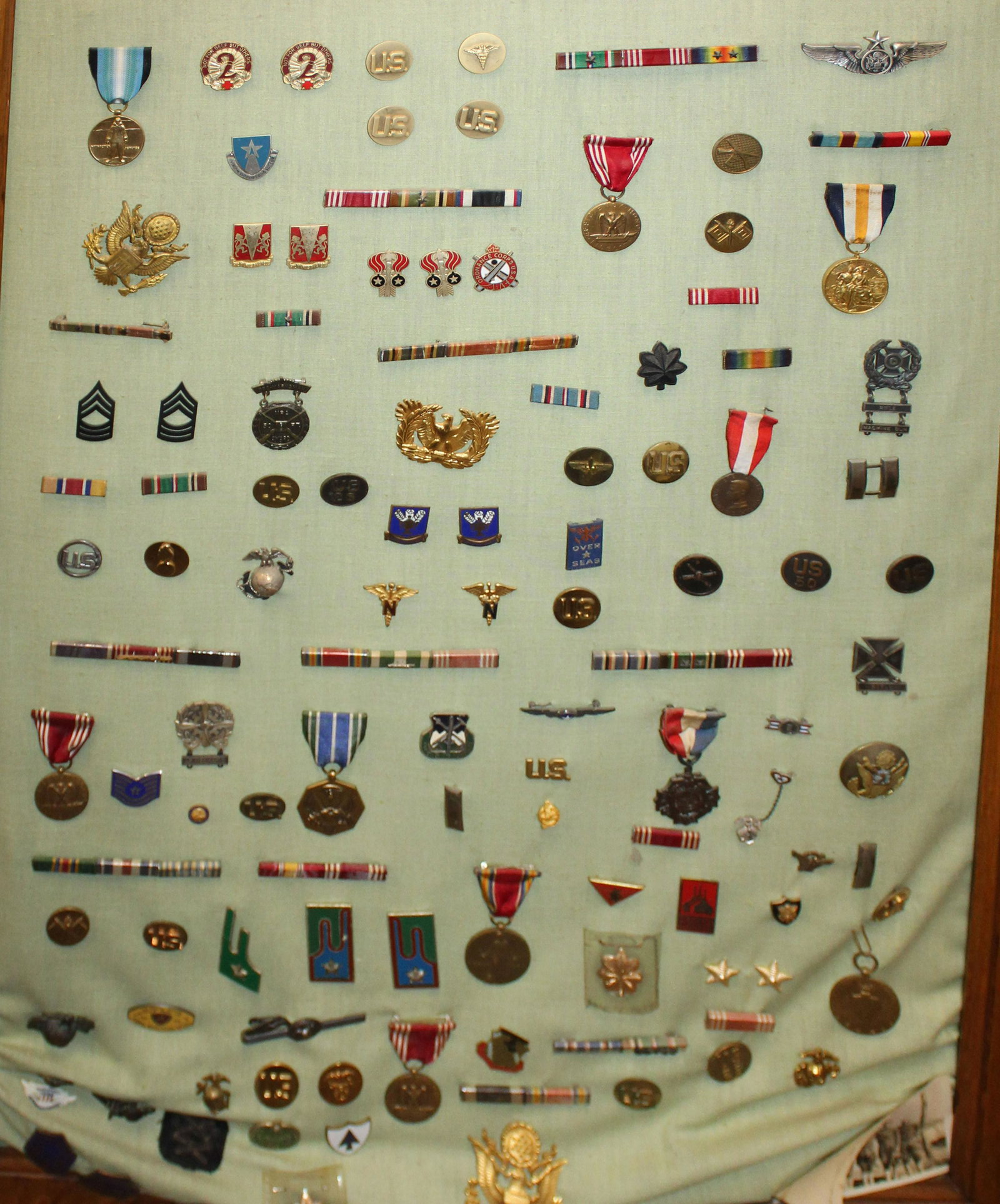 Large Lot of WWII- Desert Storm Military Insignia: Large lot of WWII- Desert Storm Military insignia and pins, medals, unit pins, rank insignia from private to general. Hundreds of Pieces on two boards.