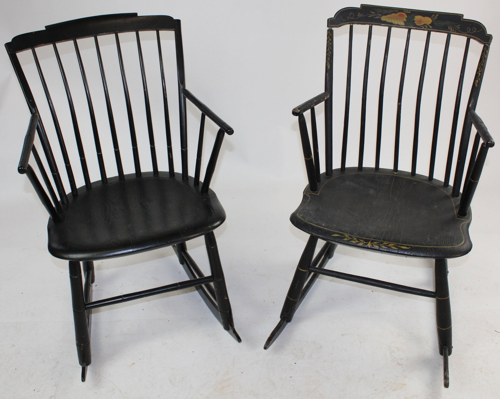 Two 19th c. Stepdown Windsor Rocking Chairs: Two 19th c. stepdown Windsor rocking chairs , both in repainted black surface, one retaining early American style tole floral decoration on top crest 33" x 21" x 27"