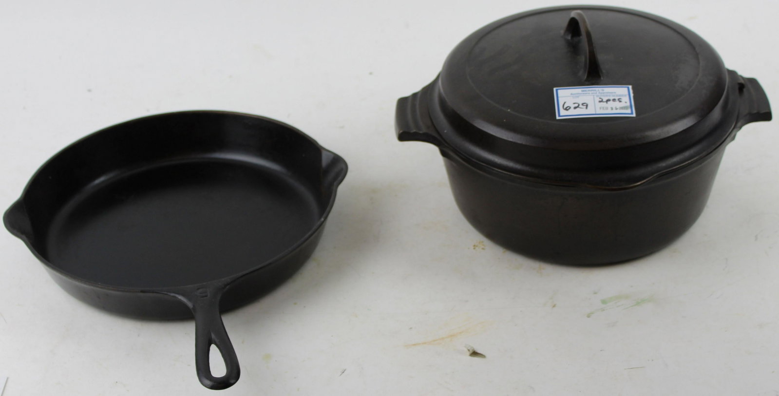 Griswold Hinged Dutch Oven and Victor Skillet: Griswold No. 8 small Letter logo hinged lid 2568 cast iron dutch oven with liner roast rack, accompanied by a Griswold Victor #9 cast iron skillet, both beautifully seasoned and ready for use 7.5" x 1