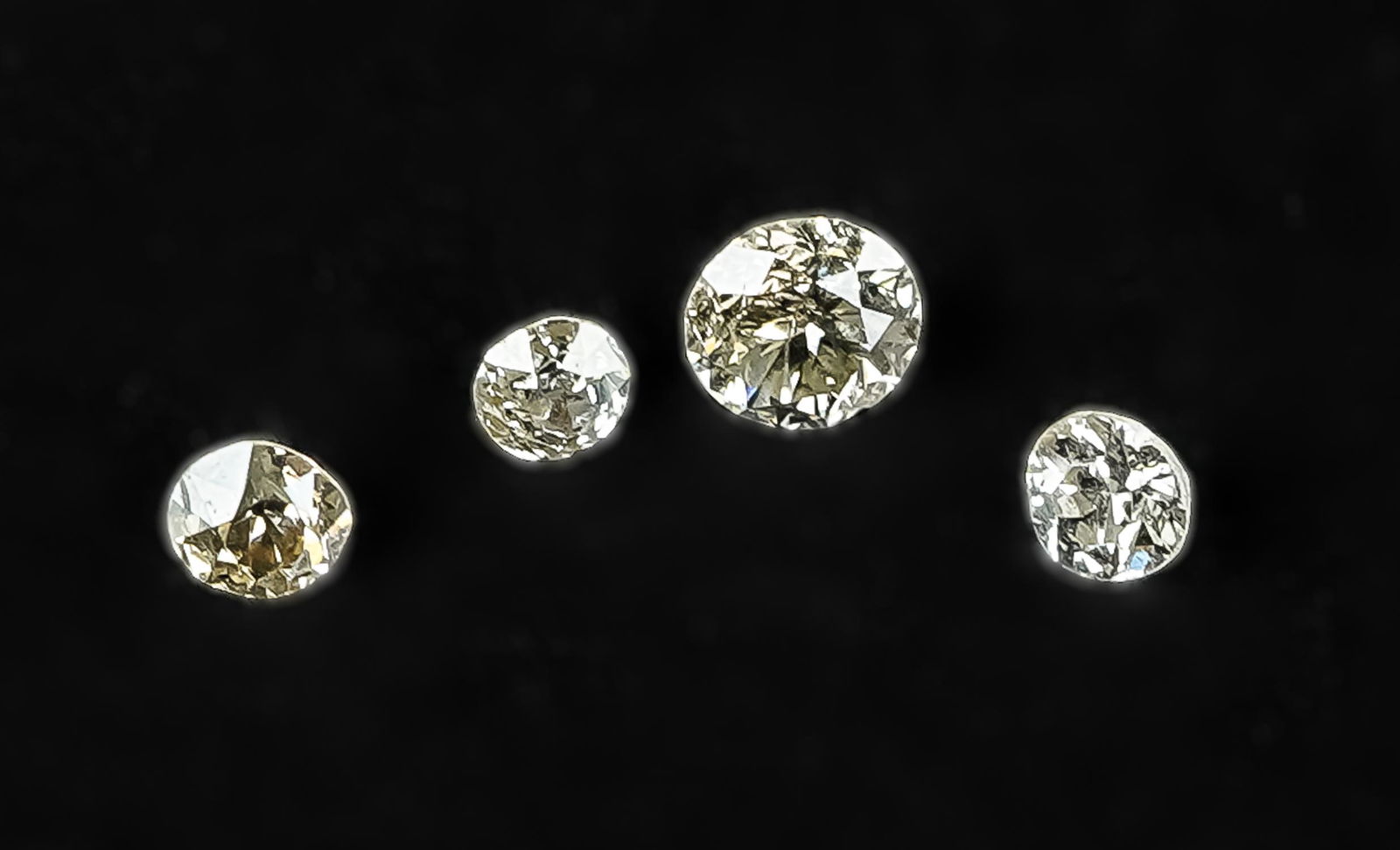 4 Loose Round Cut Diamonds: A group of 4 loose round cut diamonds including 1 .33 ct, and 3 .1 ct diamonds.