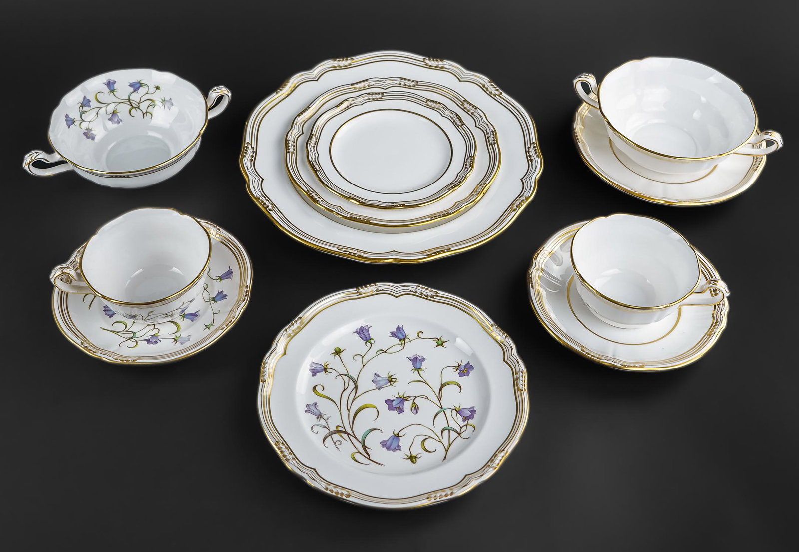 56 pcs. Spode Sheffield and Campanula China: 56 pcs. of Spode fine English bone china porcelain dinnerware, 28 pcs. "Sheffield" pattern including 4 dinner plates, 4 luncheon plates, 4 side plates, 4 cups and saucers, 4 bouillon soup bowls and sa