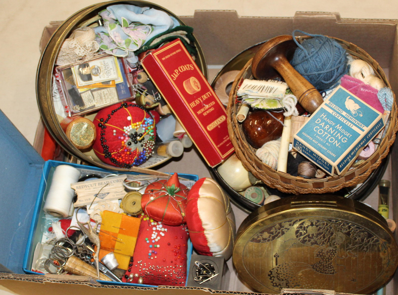 Lot of Vintage Sewing Items and Collectibles: Lot of vintage sewing and needlework items including silk strawberry emery, tomato pin cushions, early shears, Native American sweet grass cases, silk needle cases, darning eggs, spool cotton, etc.