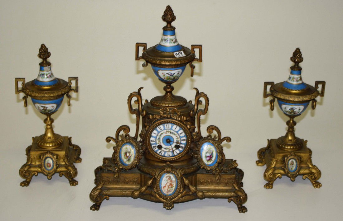 Moury French porcelain and gilt metal clock garnit: Moury French porcelain and gilt metal clock garniture set