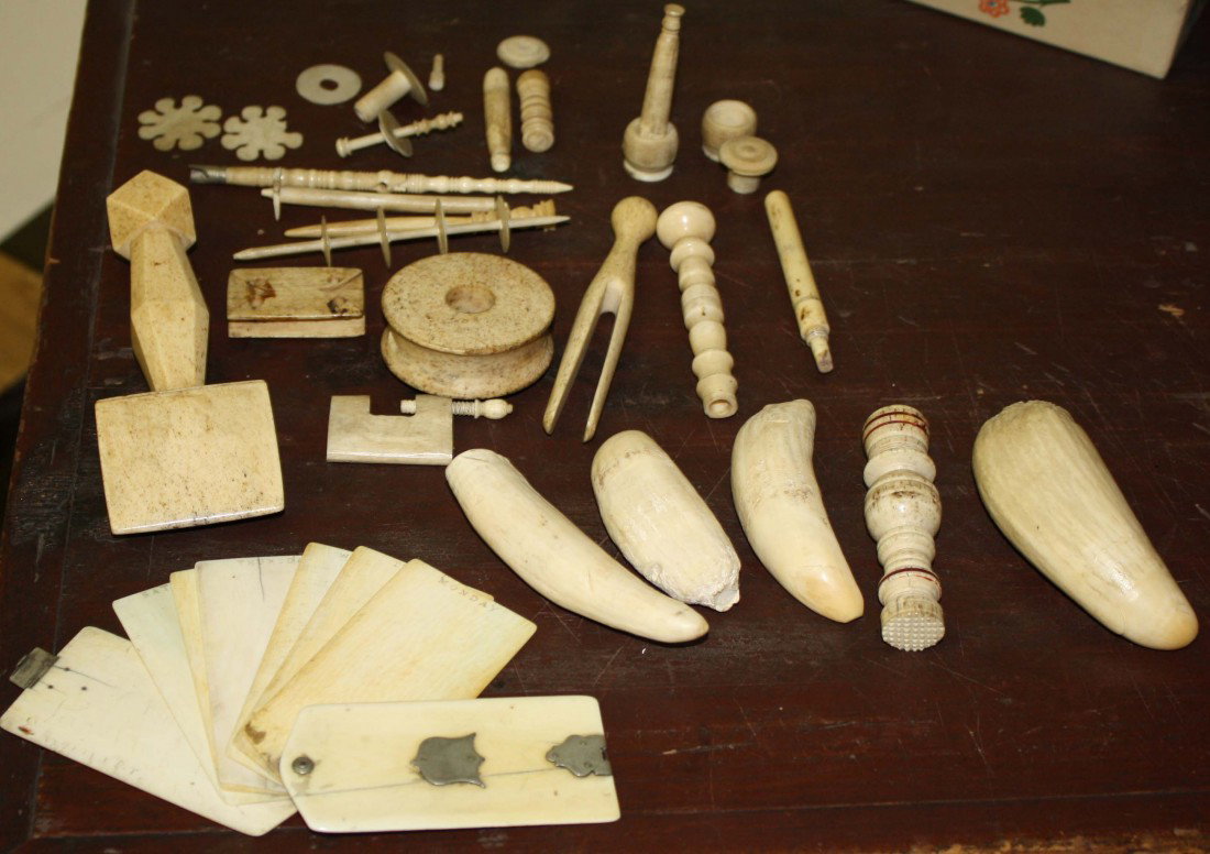 19th c carved whales tooth ivory pieces including : 19th c carved whales tooth ivory pieces including Masonic items sewing pieces ivory appointment book other everyday pieces and 4 teeth approximately 25 pieces