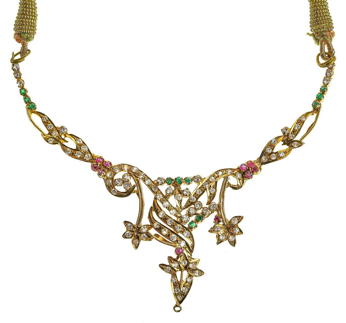 Ornate Gold Indo Necklace: Yellow gold necklace set with rubies, and colored glass with gilt cloth chain. Appears to be 9k.