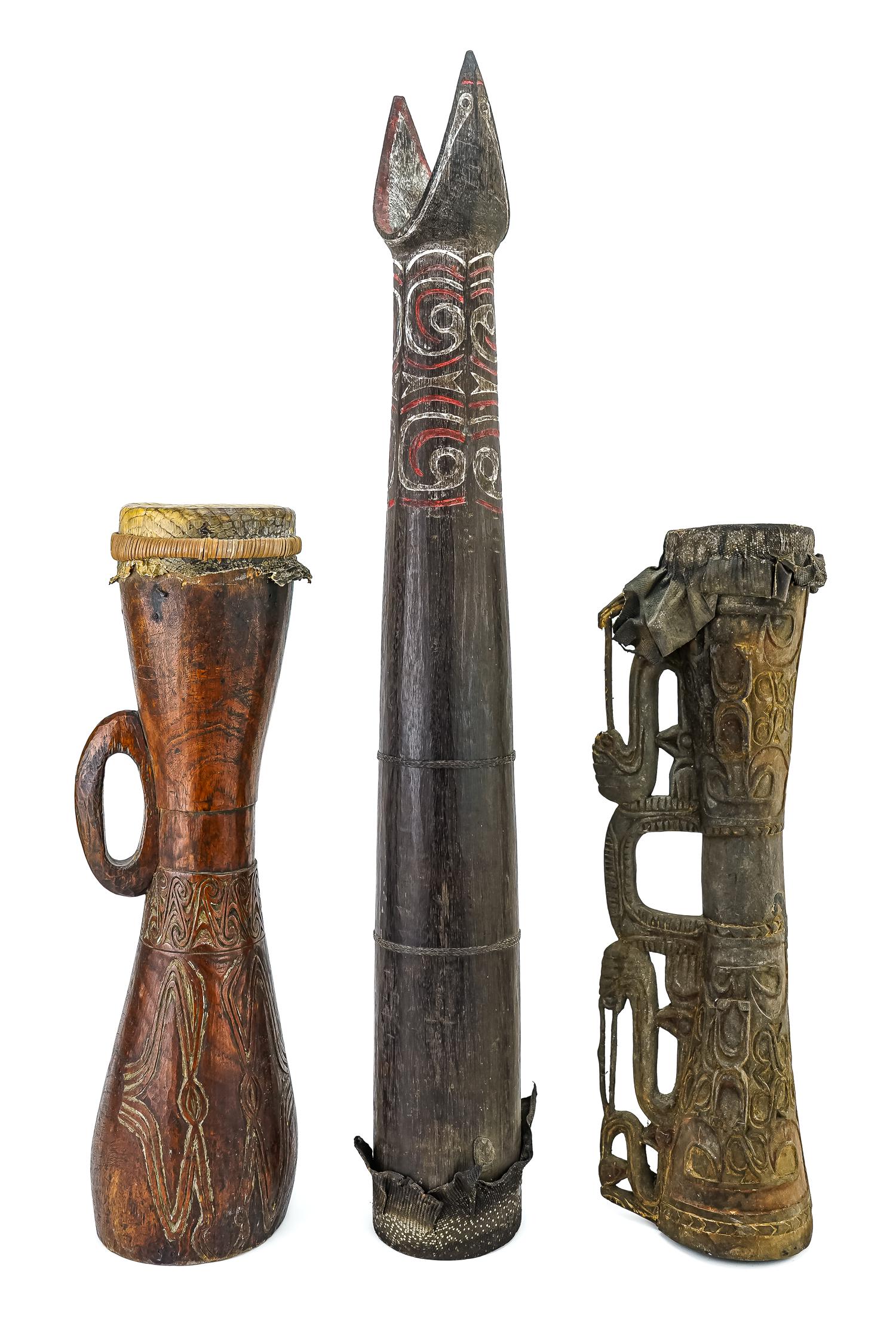 Three Papua New Guinea Drums: Three carved wooden Kundu drums from Papua New Guinea, retaining original skin drumheads. 22.5", 23", and 36" in length.