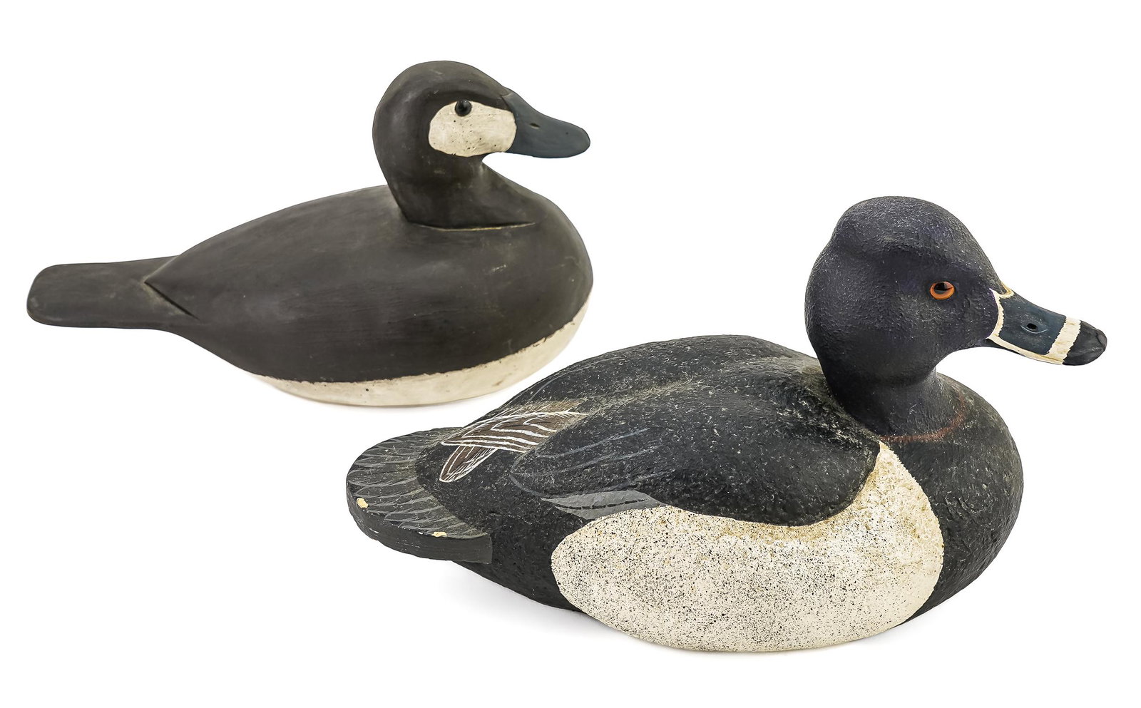 2 Don Stevens Decoys: Two Don Stevens signed decoys including a cork body blue bill and scalp. 10" long.