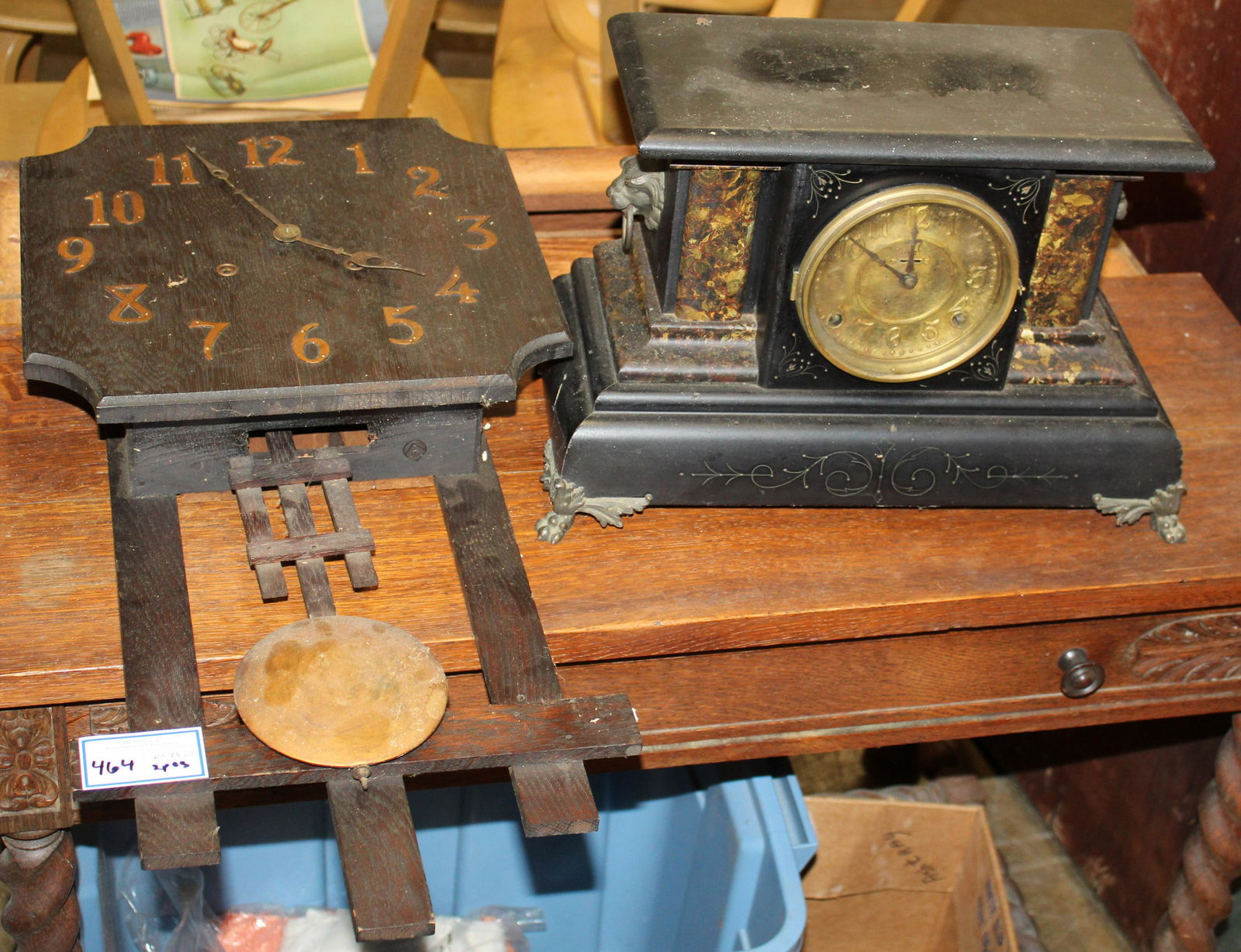 Mission Oak Wall Clock, Mantel Clock: Lot of two clocks including Arts and Crafts era Mission oak wall clock with exposed pendulum, accompanied by a Victorian ebonized and marbleized half column mantel clock, both in untested condition, h