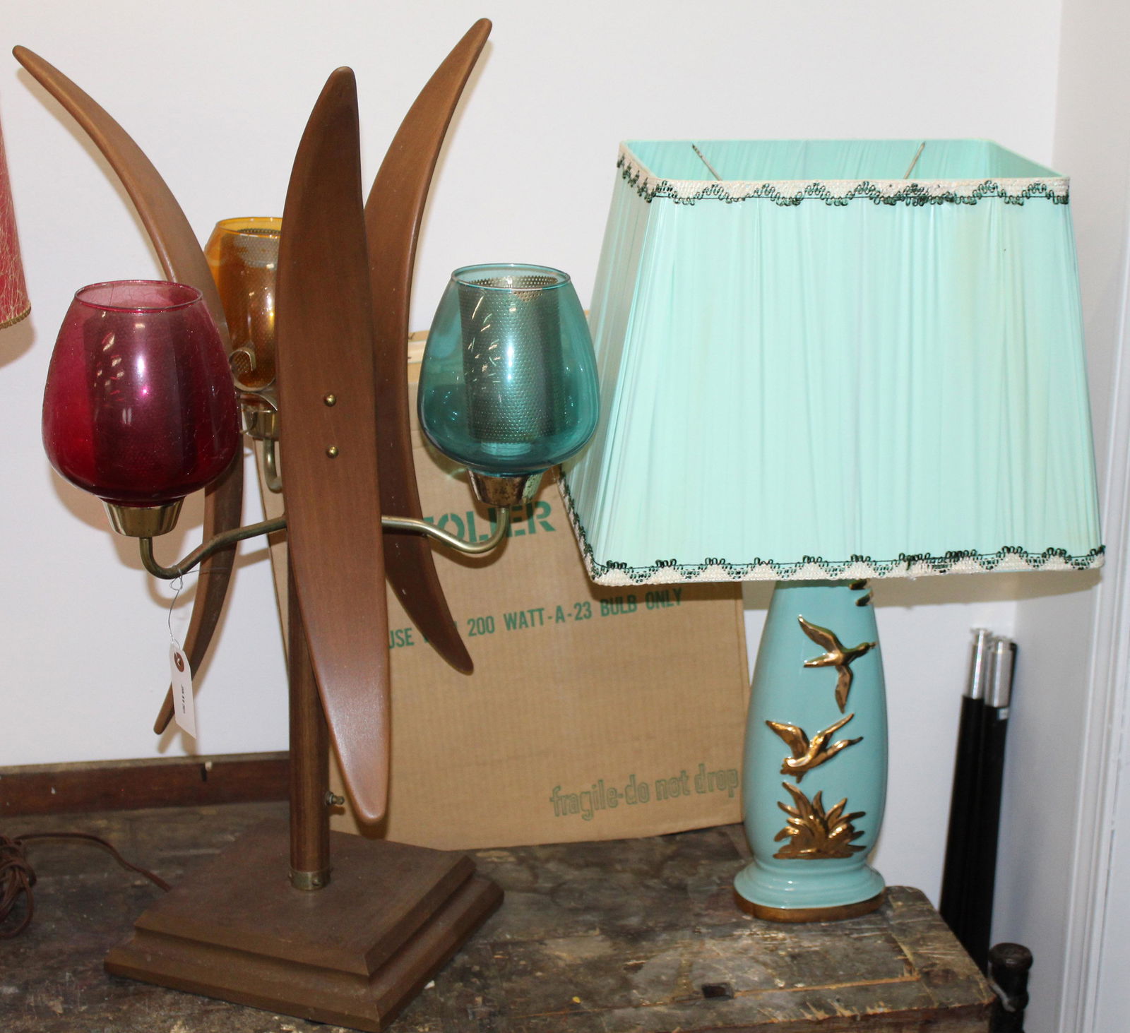 Three Vintage Retro Table Lamps: Two vintage retro table lamps including turquoise ceramic with gilt game bird decoration and original rectangular shade, accompanied by a 3 arm lamp with bent wooden panels and colored glass shades, a