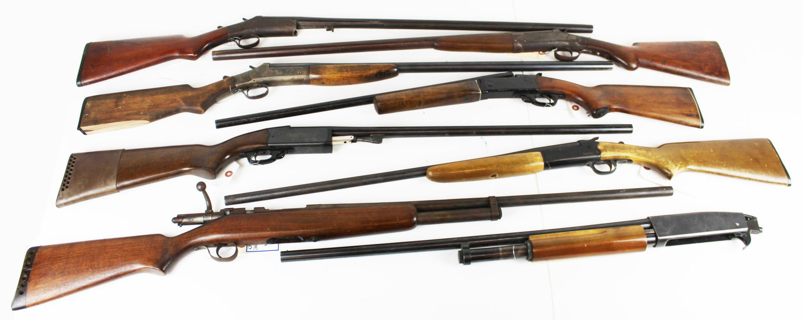 Eight Shotguns: Eight Shotguns in as found condition. FIE 20 ga shotgun, Crack in stock, Eastern Arms 12 ga, loss to buttstock, JC Higgins 583, Davenport 12 ga shotgun, with losses, Revelation 20 ga shotgun, Springfi