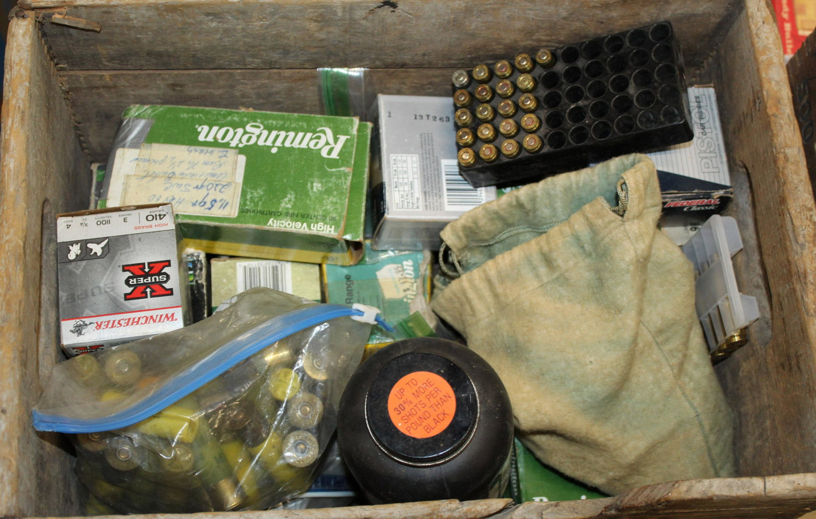 Assorted Ammo Box: Antique wood box filled with assorted ammunition. Includes 20 gauge slugs, 41 Rem Mag, 380 Auto, Muzzleloading propellent, 16 gauge, Three 41 revolver speedloaders, 25-20, 9mm, 10 gauge and .410 gauge