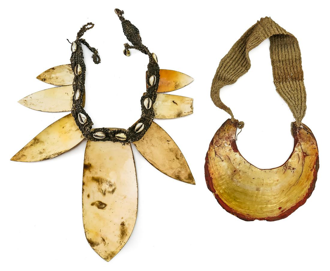 Two Large Shell Necklaces: Two large shell necklaces, includes well worn Highlands Kina, and large cowrie shell and ground shell necklace