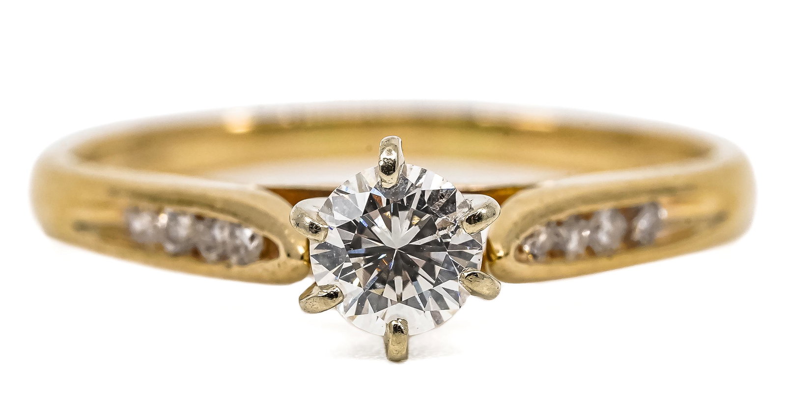 Diamond Engagement Ring: 14k yellow gold diamond engagement ring set with a 1/3 ct brilliant round cut diamond and 8 small round cut diamonds, ring size 5.5.