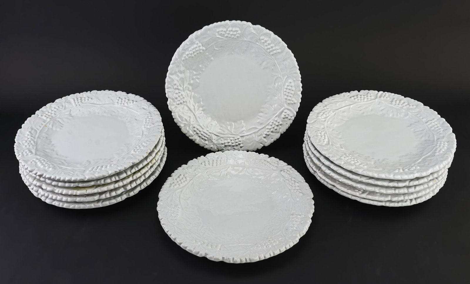 12 Italian Ceramic Grapevine Dinner Plates: Set of 12 contemporary Italian ceramic white glazed oversized dinner plates with embossed grape vine motif 11.75" dia.