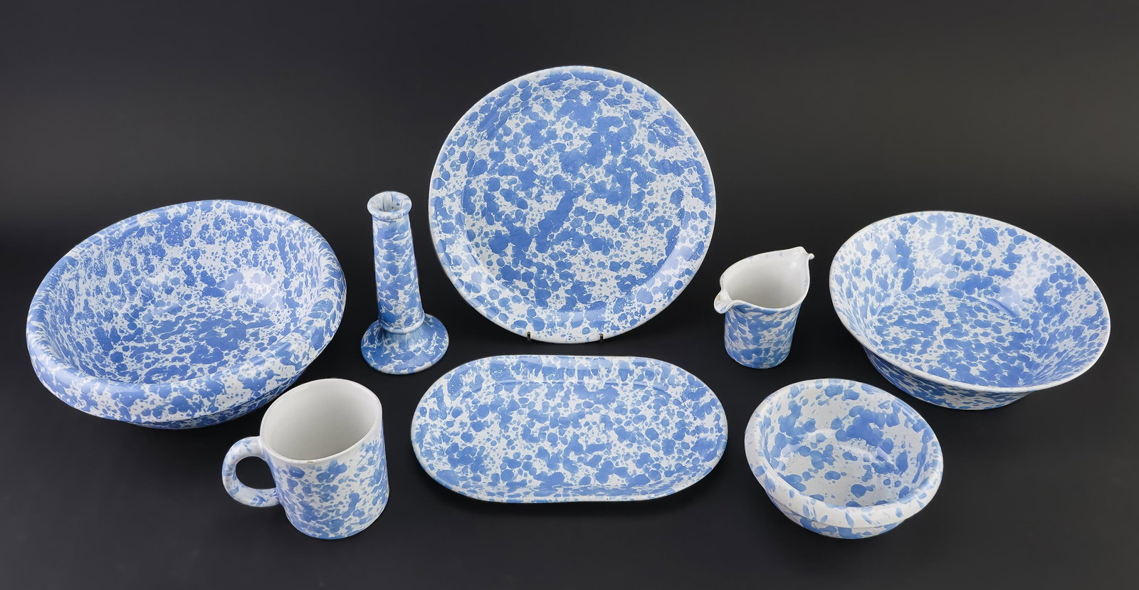 57 pcs. Bennington Pottery Blue Agate Tableware: 57 pcs. Bennington Pottery Vermont contemporary light blue agate spatter glaze tableware including candlesticks, large soup or pasta bowls, cereal bowls, dinner plates, oval serving platters side dish