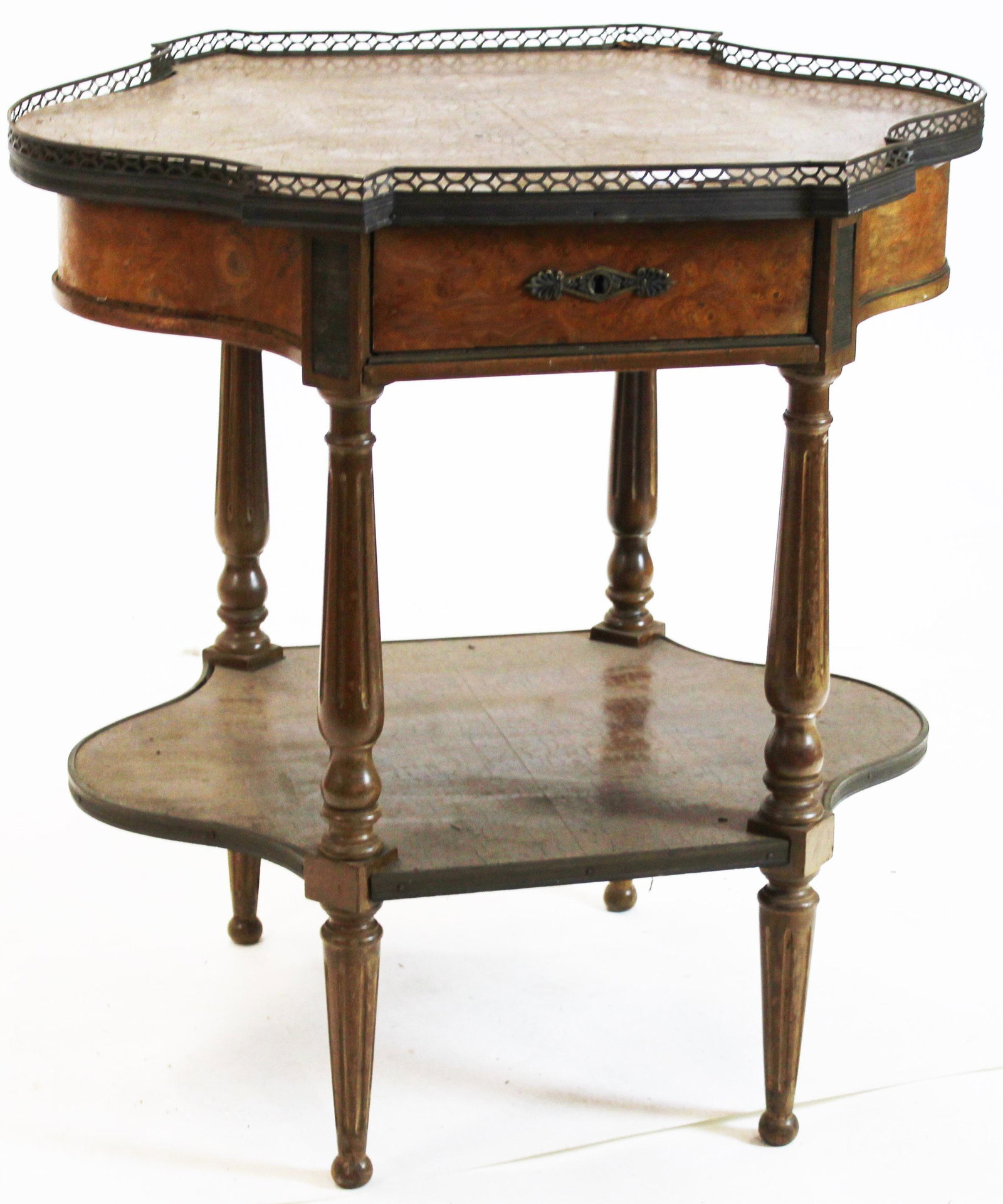 Early 20th c French Turtle Top Stand: Early 20th c French turtle top form two tier side table, top with burl veneers, gilt brass gallery, single drawer, and ormolu mounts, dry surface. 28" w, 21" d, 29"h.