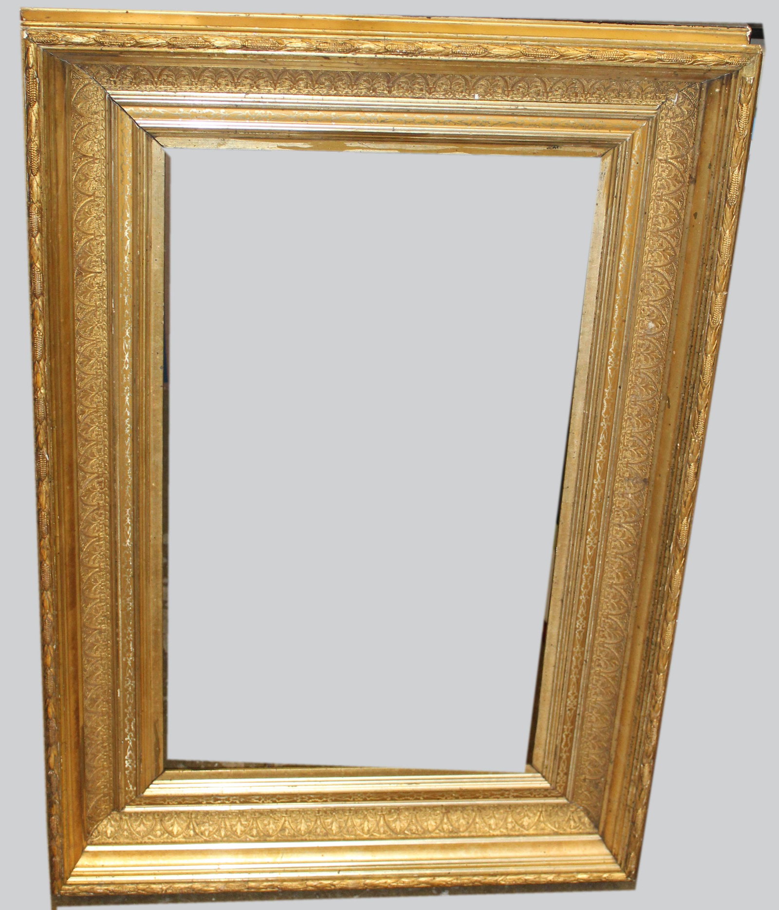 Lemon Gilt Frame with Ears of Corn: Late 19th c lemon gilt frame with ears of corn border, Collier & Perkins label, size 14 1/2" x 24 1/2" (takes 14' x 24" canvas)